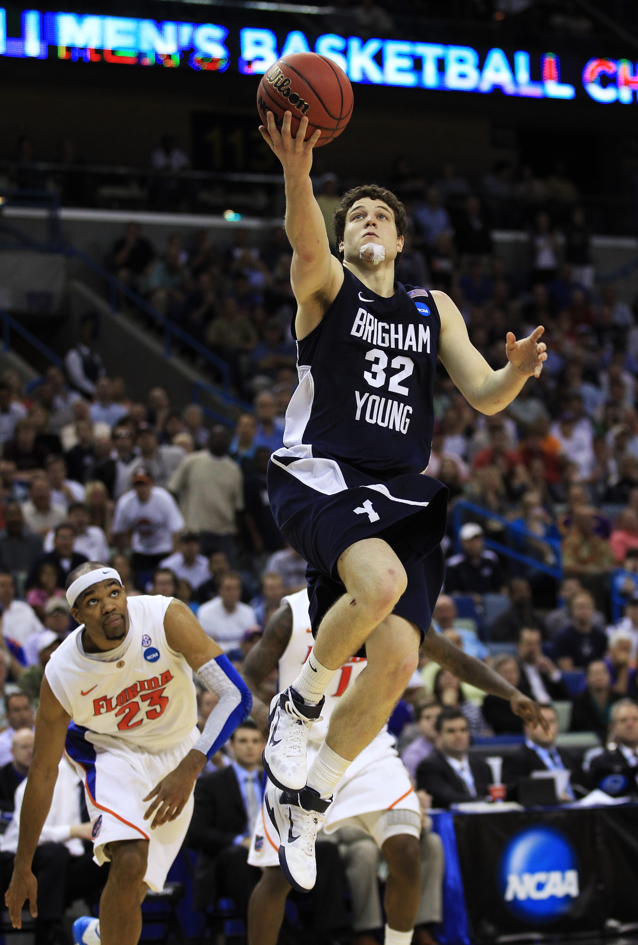 NEW ORLEANS, LA - MARCH 24: Jimmer Fredette #32 of the Brigham Young Cougars shoots against the Florida Gators during the Southeast regional of the 2011 NCAA men's basketball tournament at New Orleans Arena on March 24, 2011 in New Orleans, Louisiana. ( NEW ORLEANS, LA - MARCH 24: Jimmer Fredette #32 of the Brigham Young Cougars shoots against the Florida Gators during the Southeast regional of the 2011 NCAA men's basketball tournament at New Orleans Arena on March 24, 2011 in New Orleans, Louisiana. (