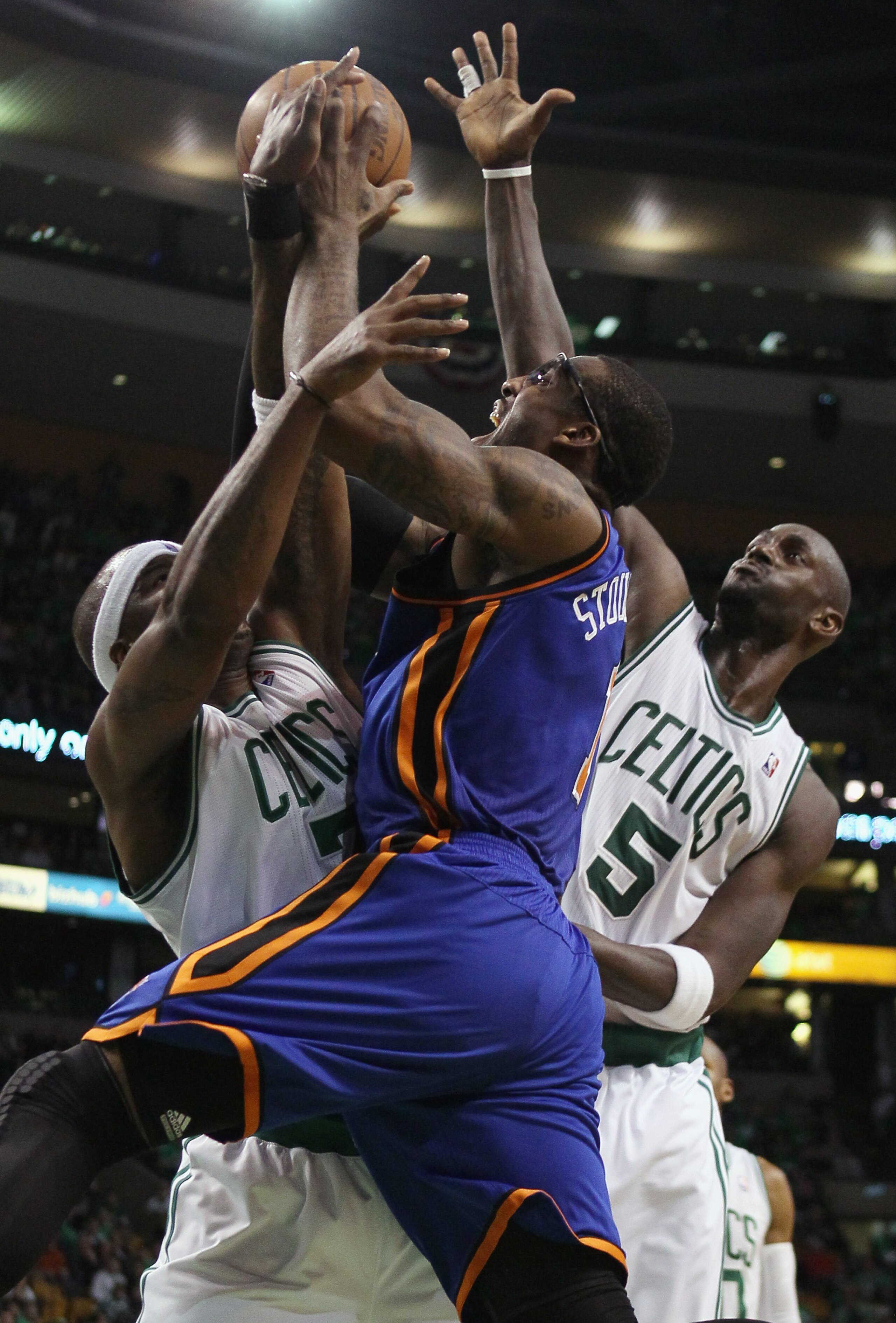 BOSTON, MA - APRIL 17:  Amare Stoudemire #1 of the New York Knicks triest to shoot around Jermaine O'Neal #7 and Kevin Garnett #5 of the Boston Celtics  in Game One of the Eastern Conference Quarterfinals in the 2011 NBA Playoffs on April 17, 2011 at the