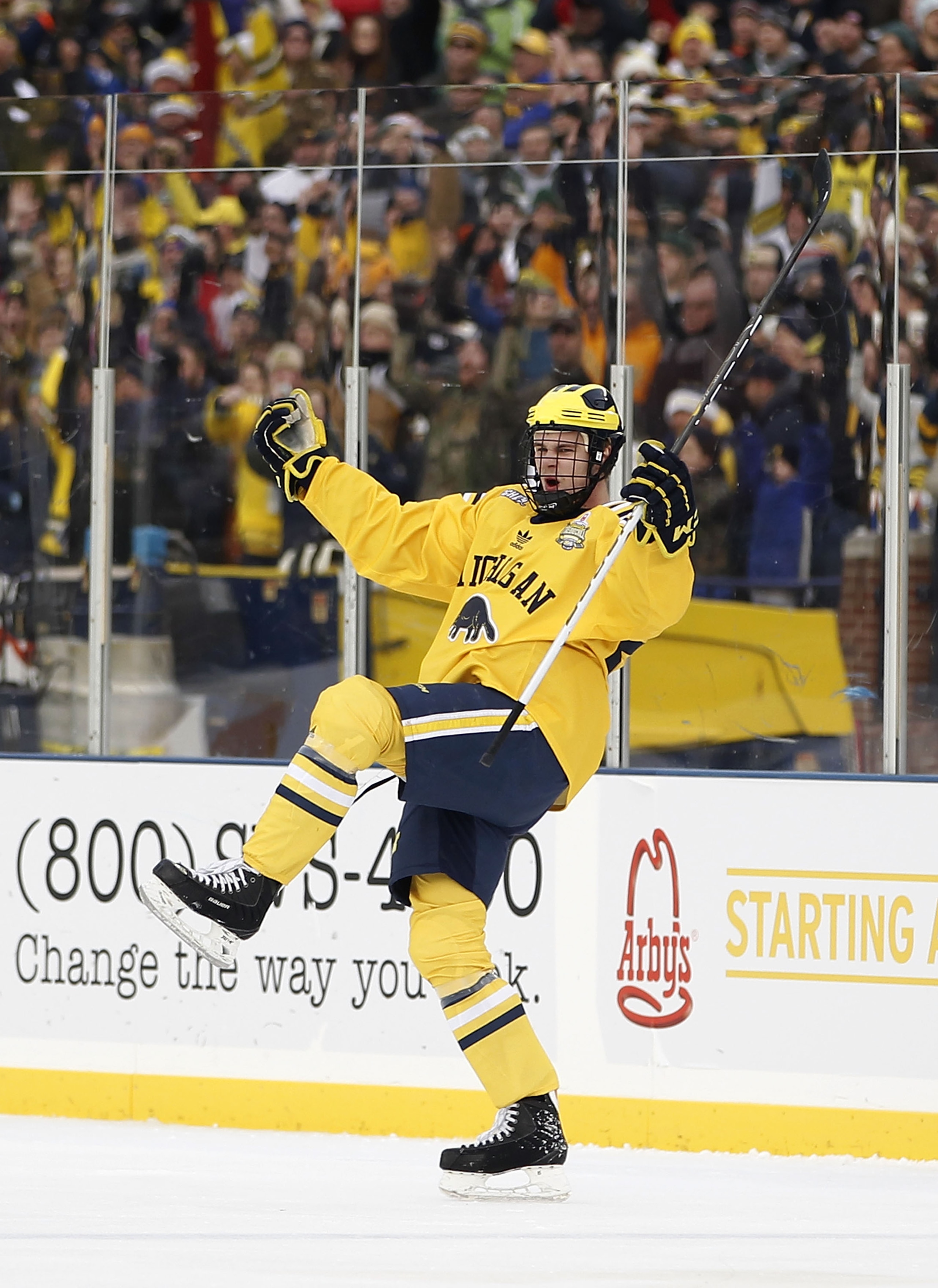 ANN ARBOR, MI - DECEMBER 11:  Jon Merrill #24 of the Michigan Wolverines celebrats a first period goal while playing the Michigan State Spartans at Michigan Stadium on December 11, 2010 in Ann Arbor, Michigan.  (Photo by Gregory Shamus/Getty Images)