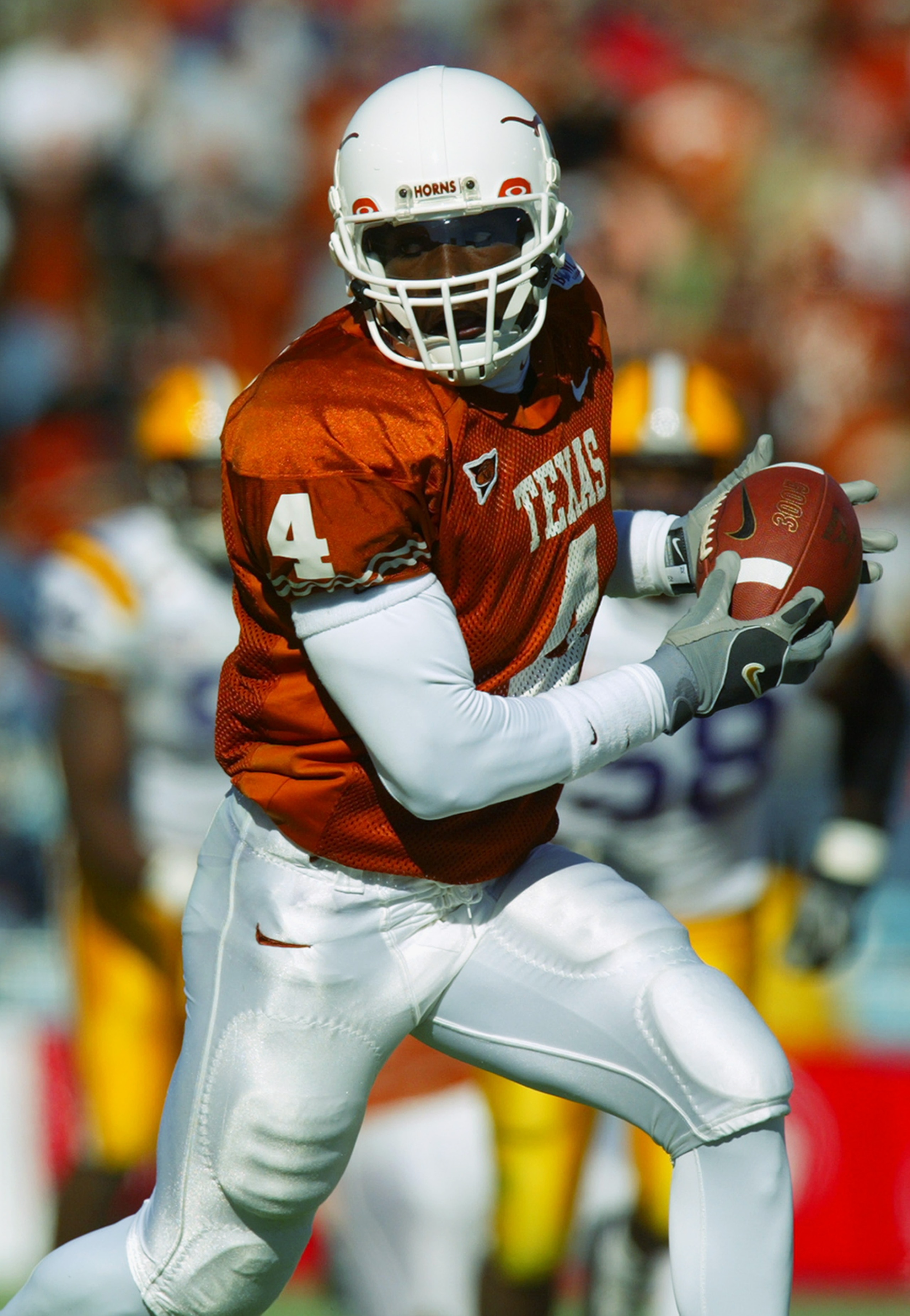 DALLAS - JANUARY 1:  Wide receiver Roy Williams #4 of the University of Texas Longhorns runs for yards against the Louisiana State University Tigers during the 67th SBC Cotton Bowl Classic on January 1, 2003 in Dallas, Texas.  Texas defeated LSU 35-20.  (