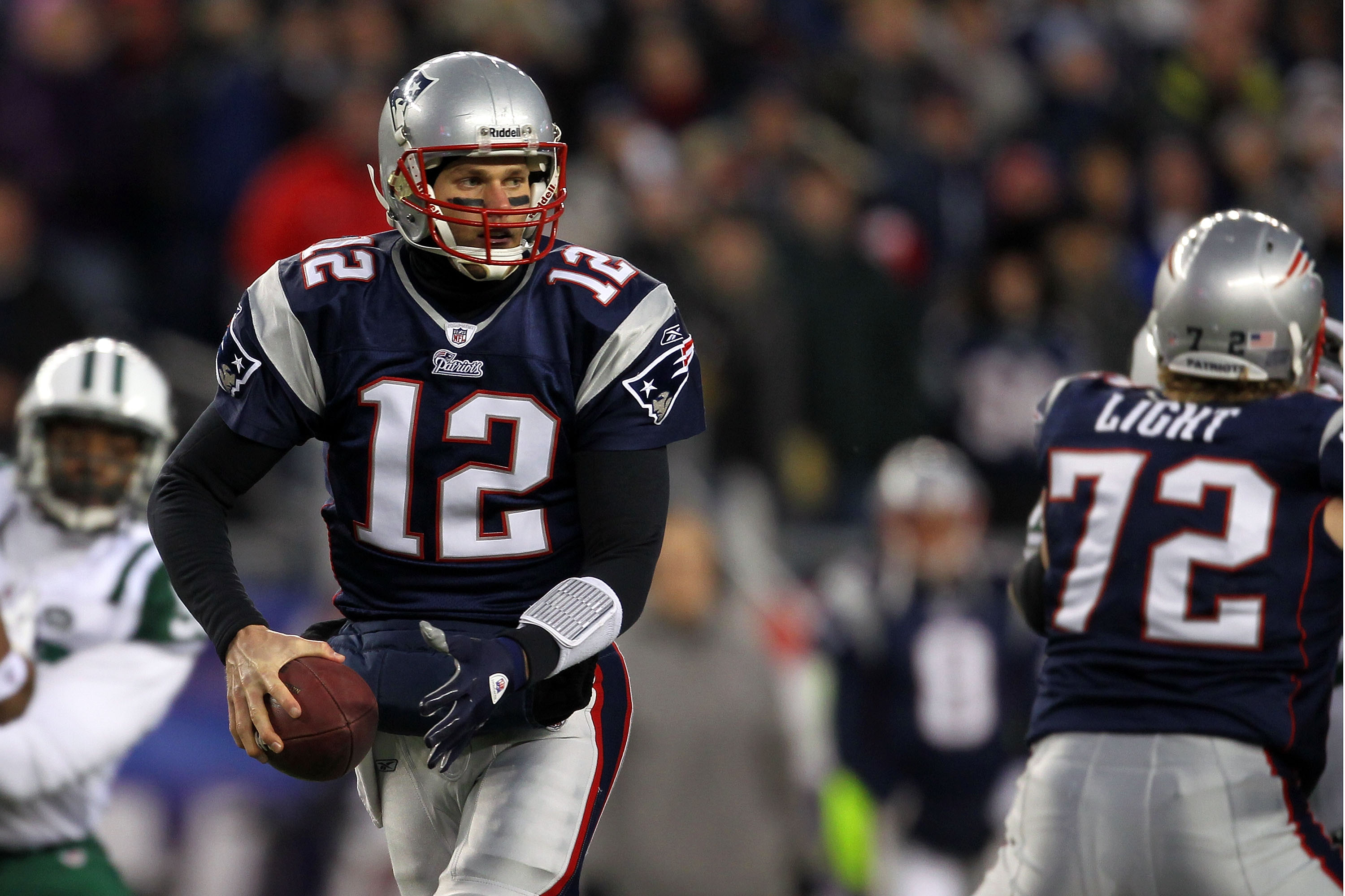 FOXBORO, MA - JANUARY 16:  Tom Brady #12 of the New England Patriots drops back against the New York Jets during their 2011 AFC divisional playoff game at Gillette Stadium on January 16, 2011 in Foxboro, Massachusetts.  (Photo by Jim Rogash/Getty Images)