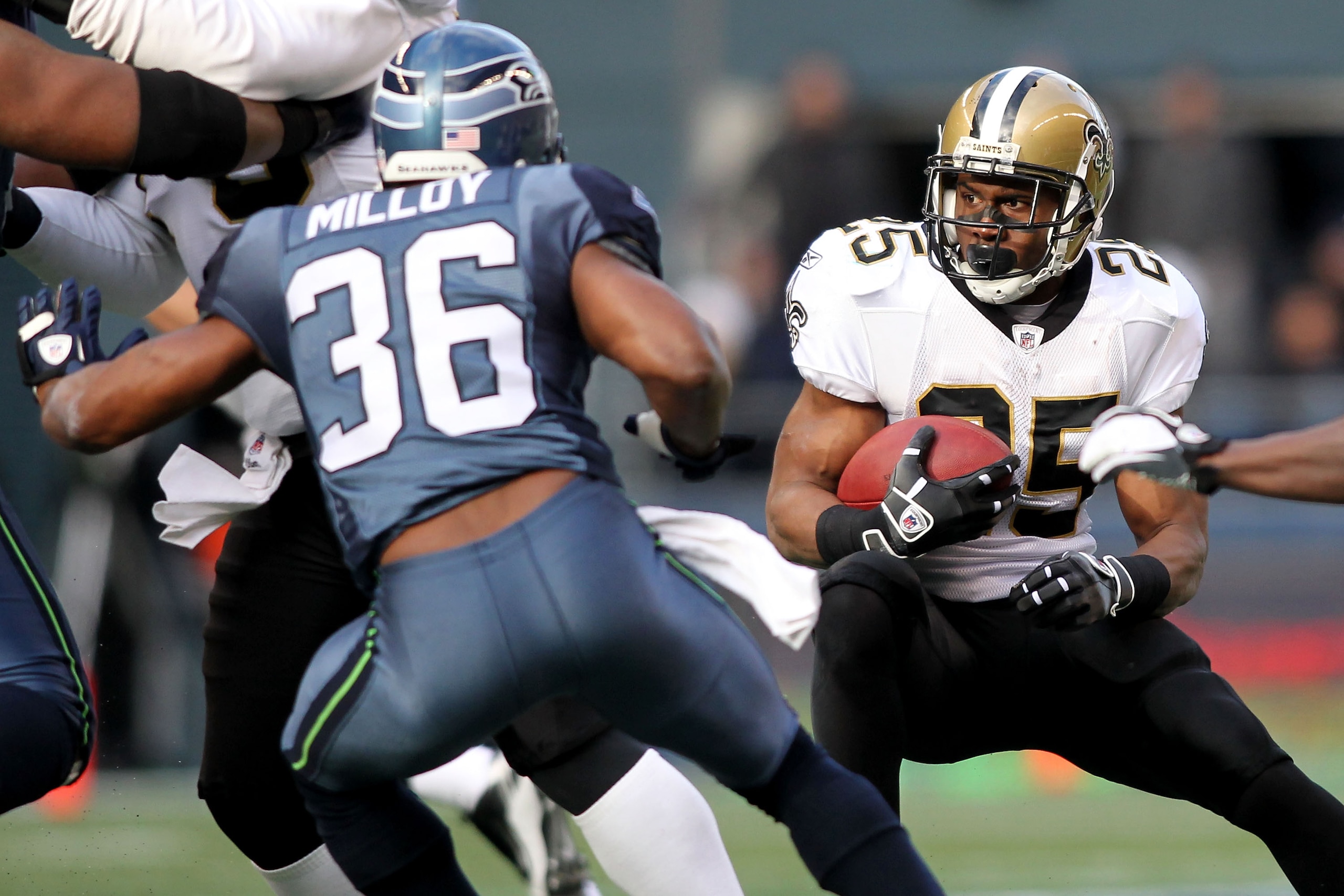 SEATTLE, WA - JANUARY 08: Reggie Bush #25 of the New Orleans Saints runs down field against Lawyer Milloy #36 of the Seattle Seahawks during the 2011 NFC wild-card playoff game at Qwest Field on January 8, 2011 in Seattle, Washington. (Photo by Jonathan SEATTLE, WA - JANUARY 08: Reggie Bush #25 of the New Orleans Saints runs down field against Lawyer Milloy #36 of the Seattle Seahawks during the 2011 NFC wild-card playoff game at Qwest Field on January 8, 2011 in Seattle, Washington. (Photo by Jonathan