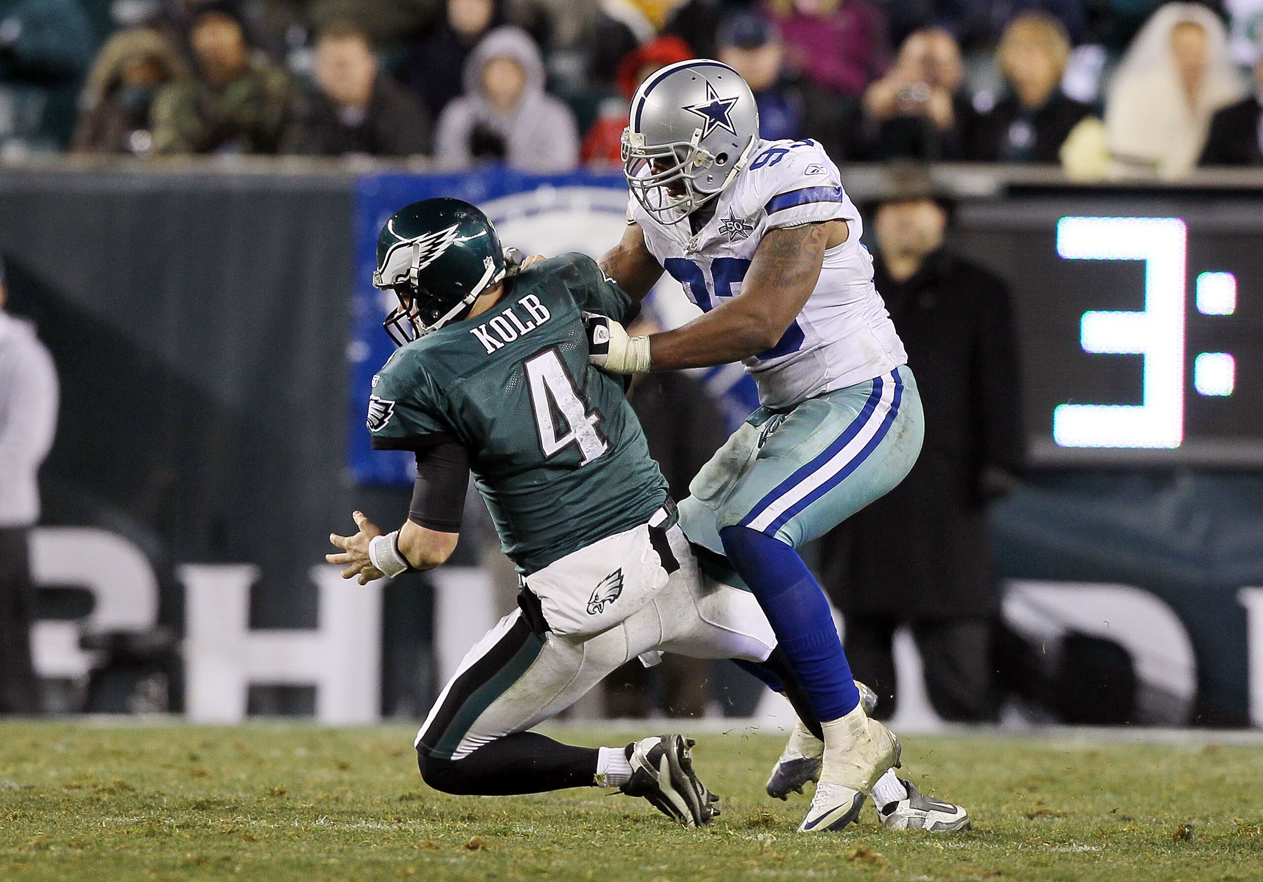 PHILADELPHIA, PA - JANUARY 02:  Kevin Kolb #4 of the Philadelphia Eagles is sacked by Anthony Spencer #93 of the Dallas Cowboys on January 2, 2011 at Lincoln Financial Field in Philadelphia, Pennsylvania. The Cowboys defeated the Eagles 14-13.  (Photo by 