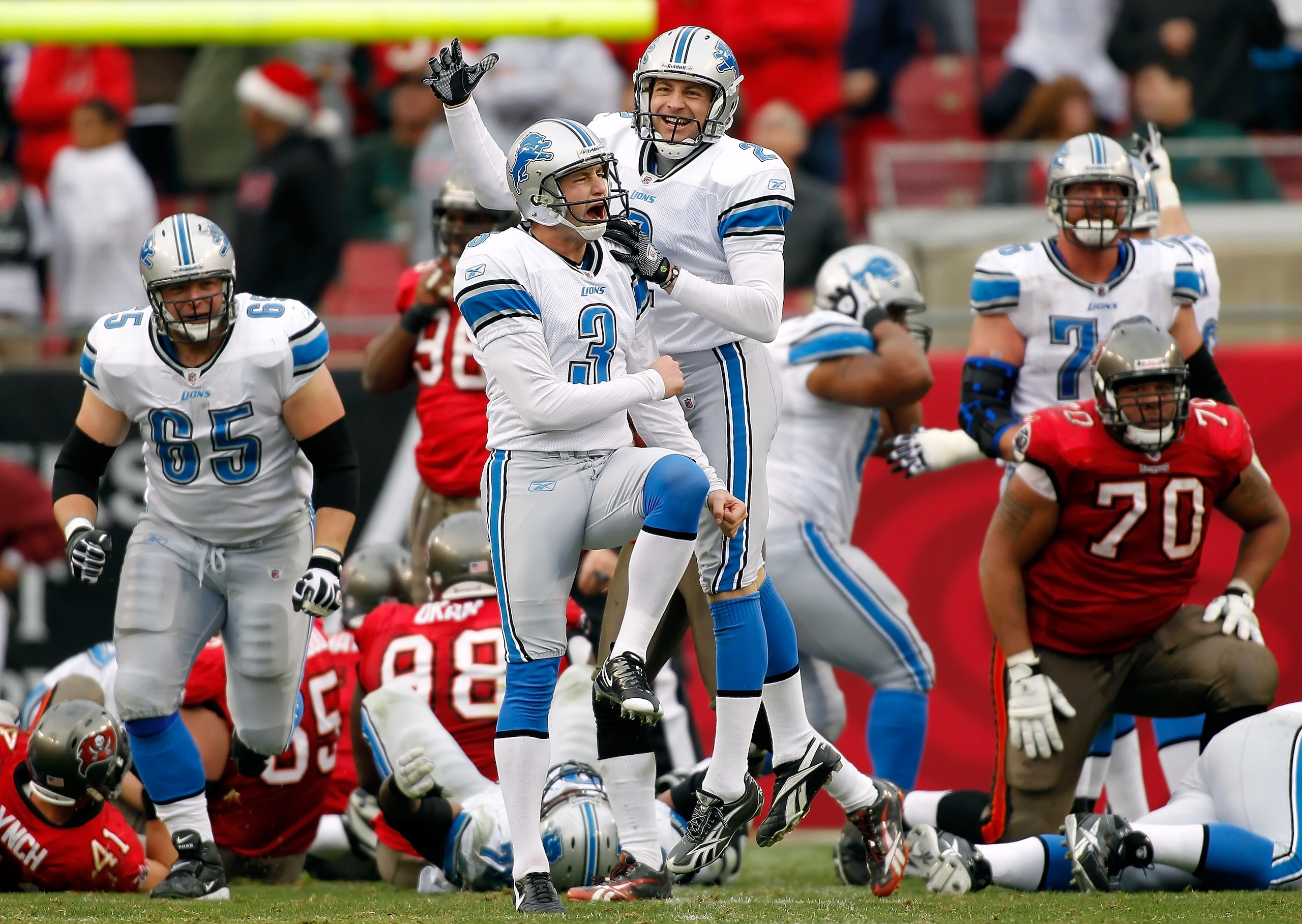 TAMPA, FL - DECEMBER 19:  Kicker Dave Rayner #3 of the Detroit Lions celebrates with holder Nick Harris #2 the winning field goal in overtime against the Tampa Bay Buccaneers during the game at Raymond James Stadium on December 19, 2010 in Tampa, Florida.