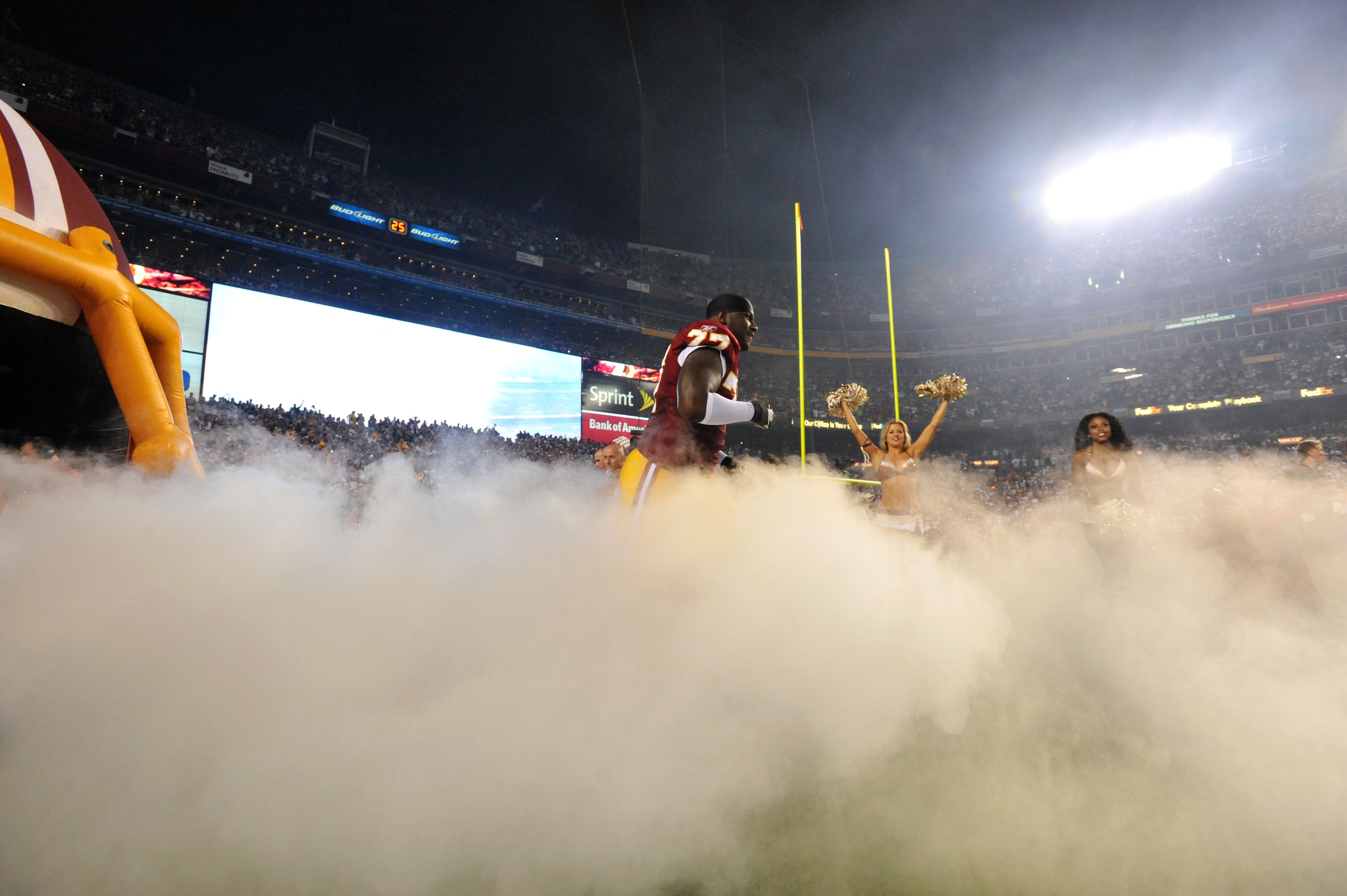 LANDOVER - SEPTEMBER 12:  Jammal Brown #77 of the Washington Redskins runs onto the field during the NFL season opener against the Dallas Cowboys at FedExField on September 12, 2010 in Landover, Maryland. The Redskins defeated the Cowboys 13-7. (Photo by