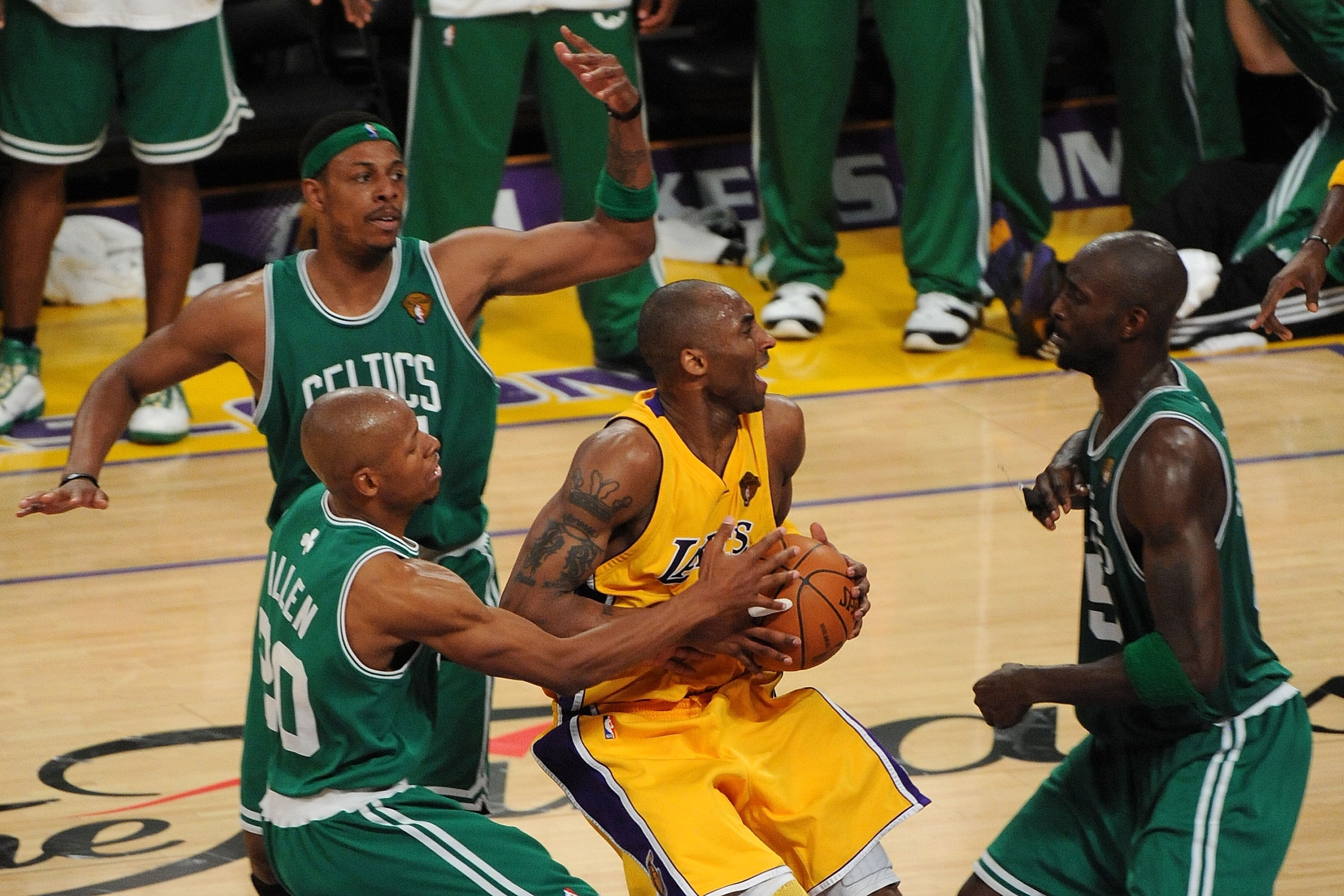 LOS ANGELES, CA - JUNE 17:  Kobe Bryant #24 of the Los Angeles Lakers drives between Ray Allen #20, Kevin Garnett #5 and Paul Pierce #34 of the Boston Celtics in the third quarter of Game Seven of the 2010 NBA Finals at Staples Center on June 17, 2010 in