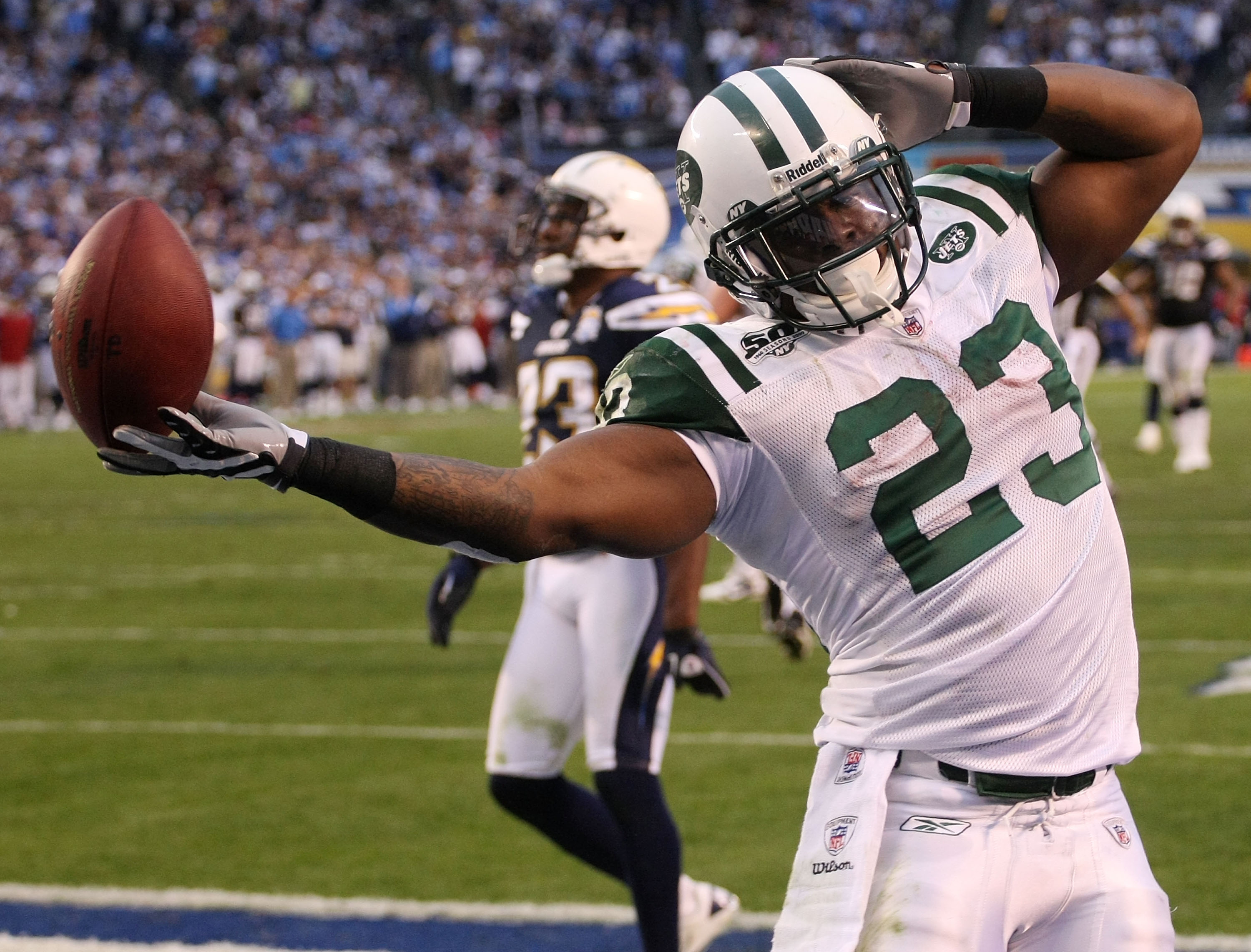 New York Jets corner back Darrelle Revis (24) celebrates after making an  interception in the third quarter against the San Diego Chargers at the  2010 AFC divisional playoff game at Qualcomm Stadium