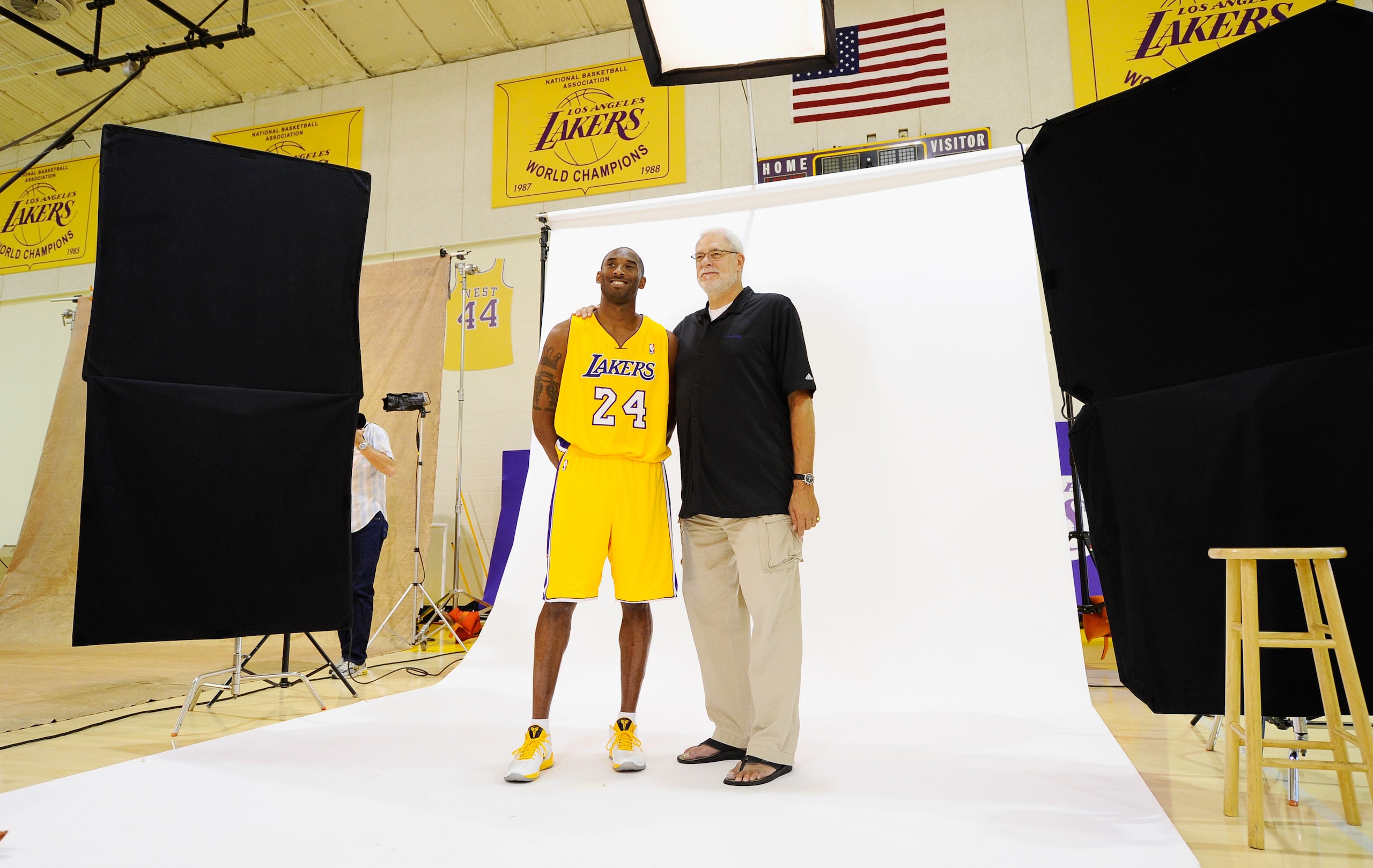 EL SEGUNDO, CA - SEPTEMBER 25:  Kobe Bryant #24 and head coach Phil Jackson of the Los Angeles Lakers pose with NBA Finals Larry O'Brien Championship Trophy during  Media Day at the Toyota Center on September 25, 2010 in El Segundo, California. NOTE TO US