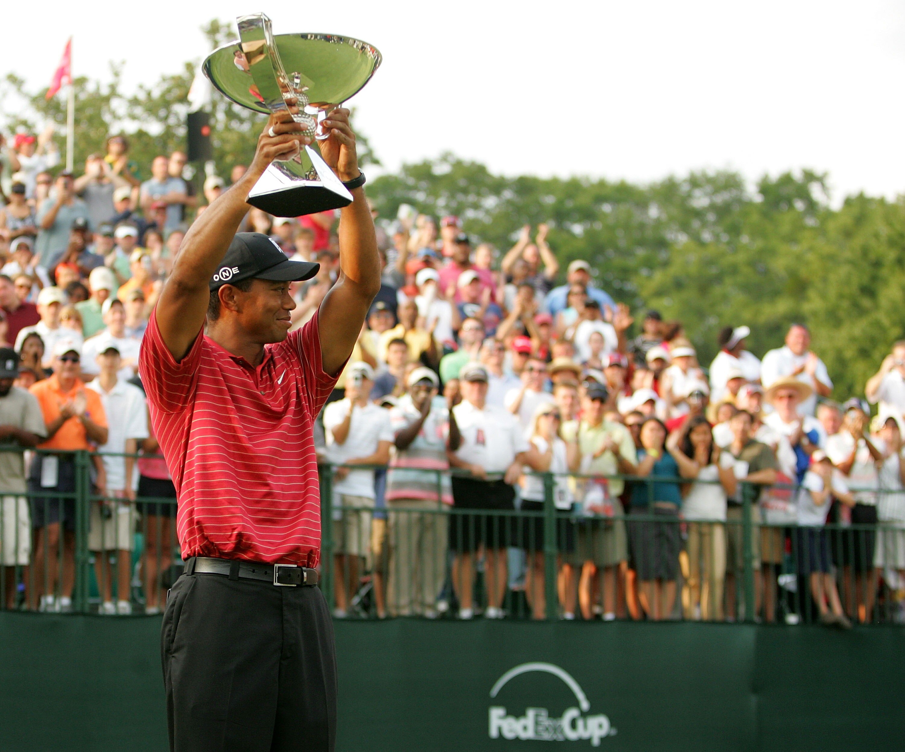 ATLANTA - SEPTEMBER 16:  Tiger Woods holds the FedEx Cup trophy after winning the TOUR Championship, the final event of the new PGA TOUR Playoffs for the FedExCup at East Lake Golf Club on September 16, 2007 in Atlanta, Georgia.  (Photo by Streeter Lecka/