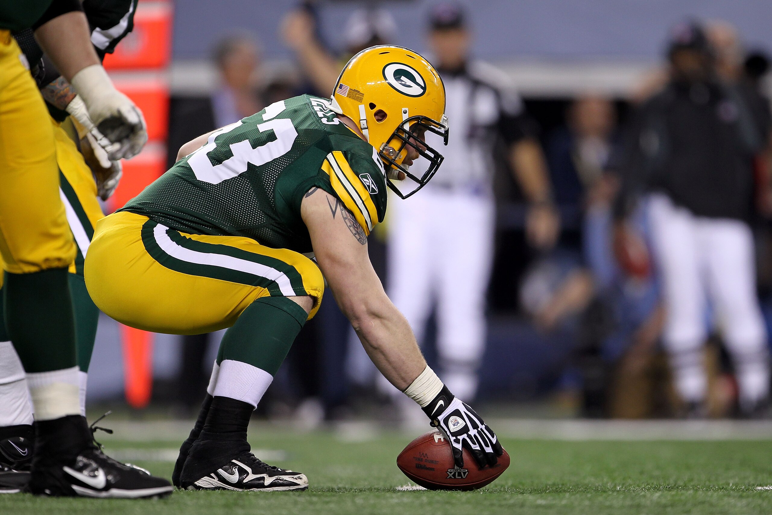 ARLINGTON, TX - FEBRUARY 06:  Center Scott Wells #63 of the Green Bay Packers gets set to snap the ball against the Pittsburgh Steelers during Super Bowl XLV at Cowboys Stadium on February 6, 2011 in Arlington, Texas. The Packers won 31-25. (Photo by Jami