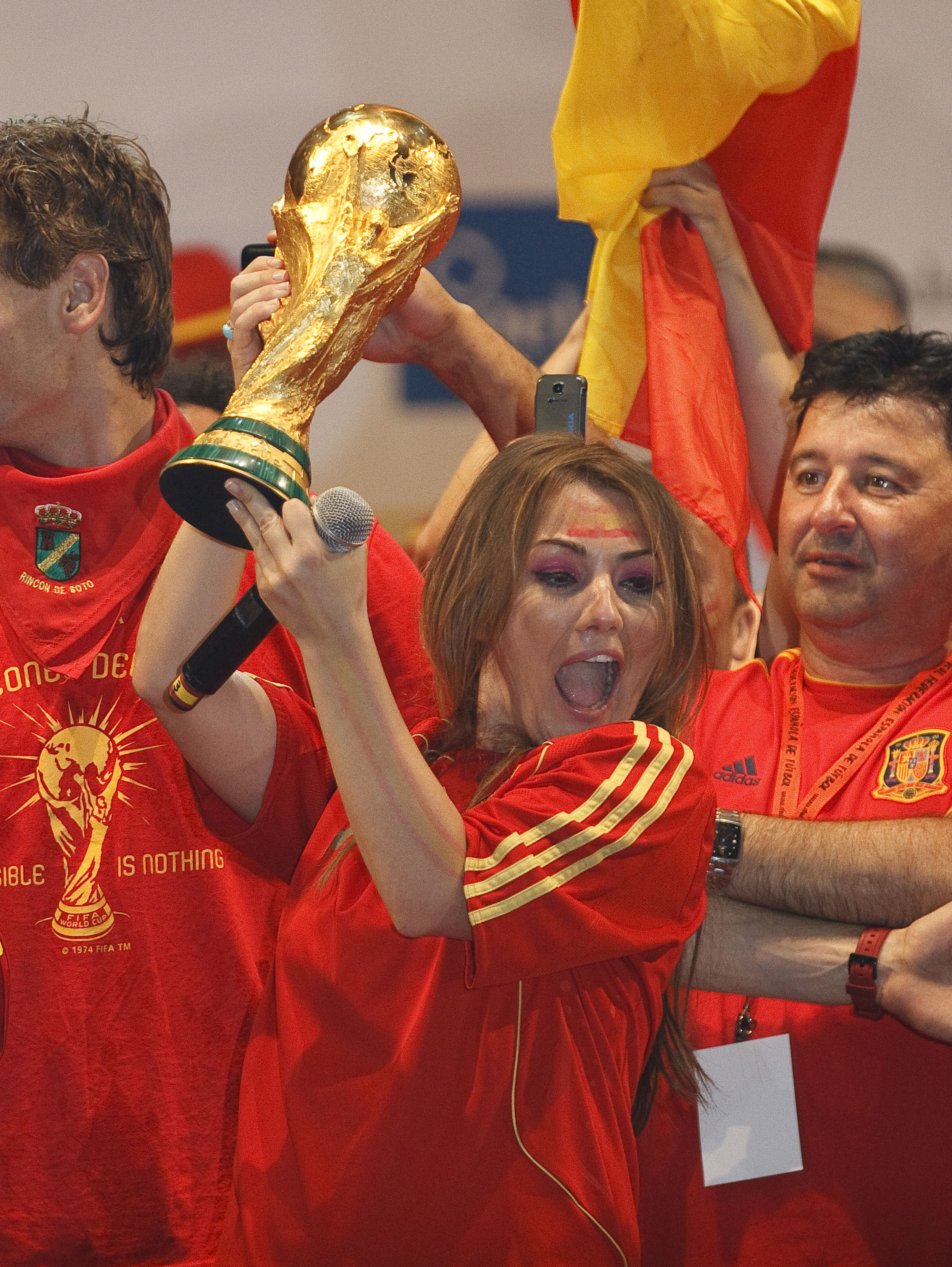 MADRID, SPAIN - JULY 12:  MADRID, SPAIN - JULY 12: Spanish singer Amaia Montero with the trophy on a stage set up for the Spanish team victory ceremony on July 12, 2010 in Madrid, Spain. Spain won the 2010 FIFA football World Cup match against the Netherl