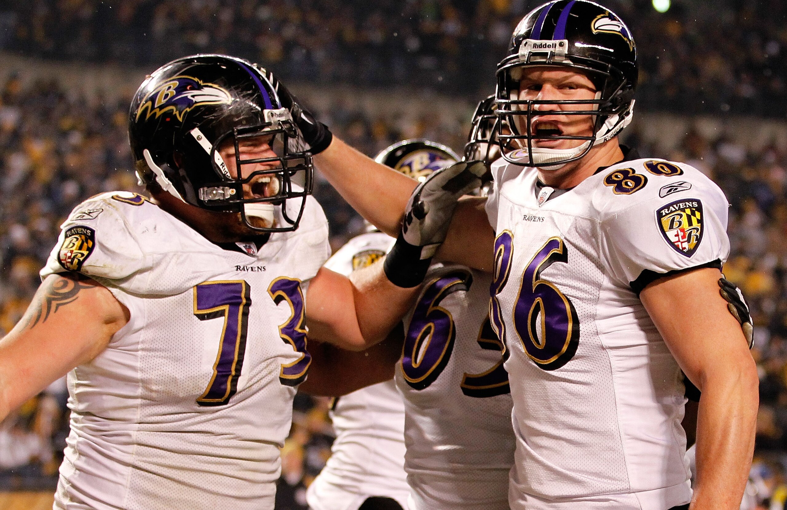 PITTSBURGH, PA - JANUARY 15:  Tight end Todd Heap #86 of the Baltimore Ravens celebrates with teammates after scoring on a four-yard touchdown pass against the Pittsburgh Steelers in the second quarter of the AFC Divisional Playoff Game at Heinz Field on