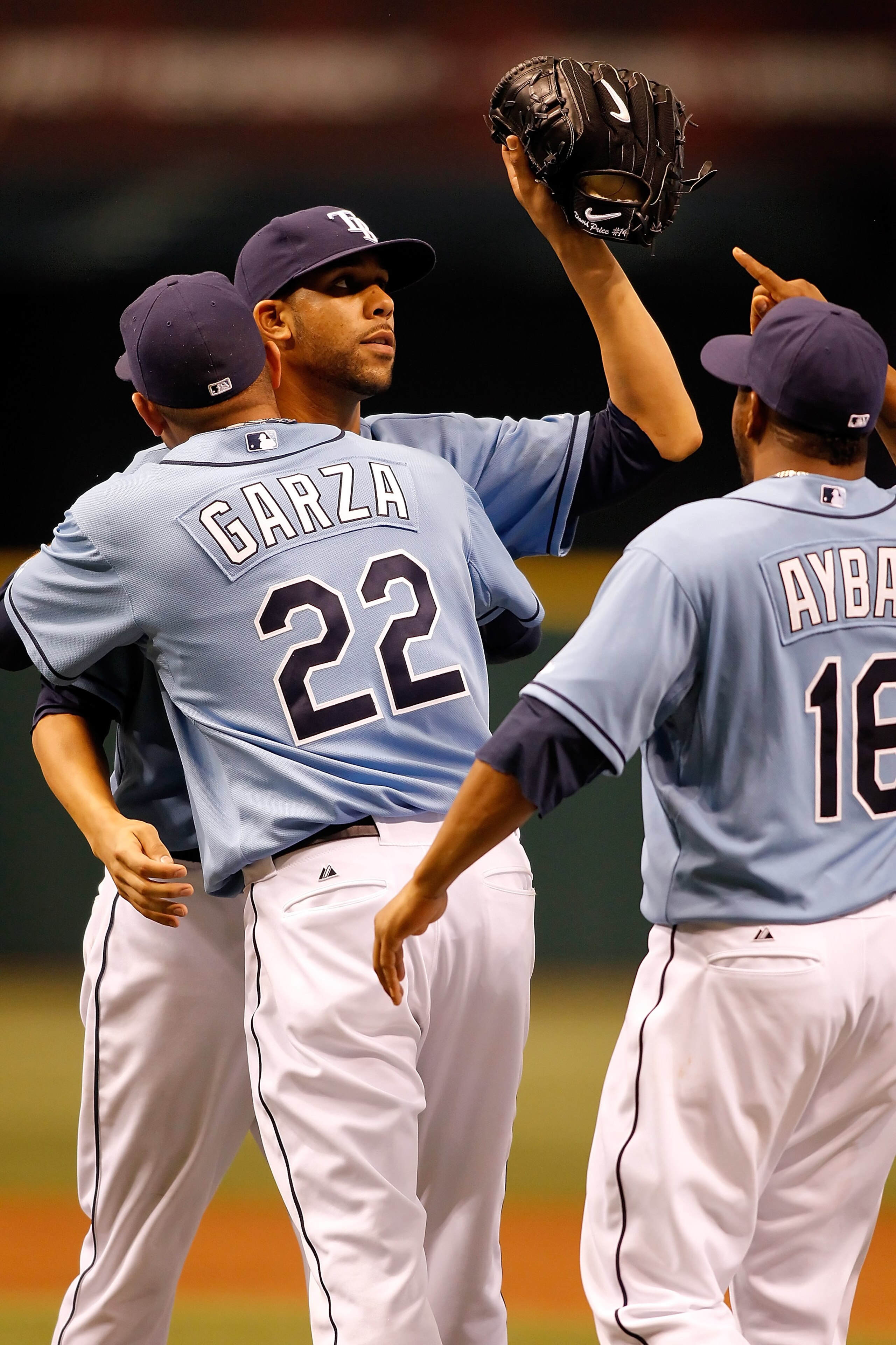ST. PETERSBURG - APRIL 25: Pitcher David Price is congratulated by pitcher Matt Garza #22 and infielder Willy Aybar #16 of the Tampa Bay Rays after his complete game shutout against the Toronto Blue Jays at Tropicana Field on April 25, 2010 in St. Peters ST. PETERSBURG - APRIL 25: Pitcher David Price is congratulated by pitcher Matt Garza #22 and infielder Willy Aybar #16 of the Tampa Bay Rays after his complete game shutout against the Toronto Blue Jays at Tropicana Field on April 25, 2010 in St. Peters