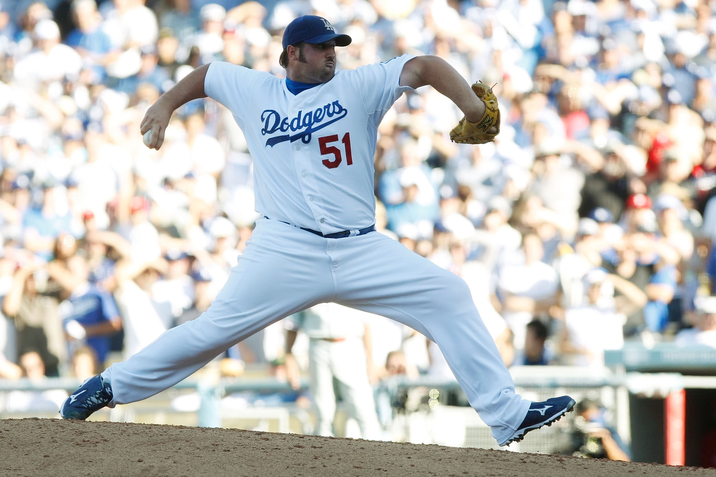 LOS ANGELES, CA - OCTOBER 16:  Jonathan Broxton #51 of the Los Angeles Dodgers pitches against the Philadelphia Phillies during Game Two of the NLCS during the 2009 MLB Playoffs at Dodger Stadium on October 16, 2009 in Los Angeles, California.  (Photo by 