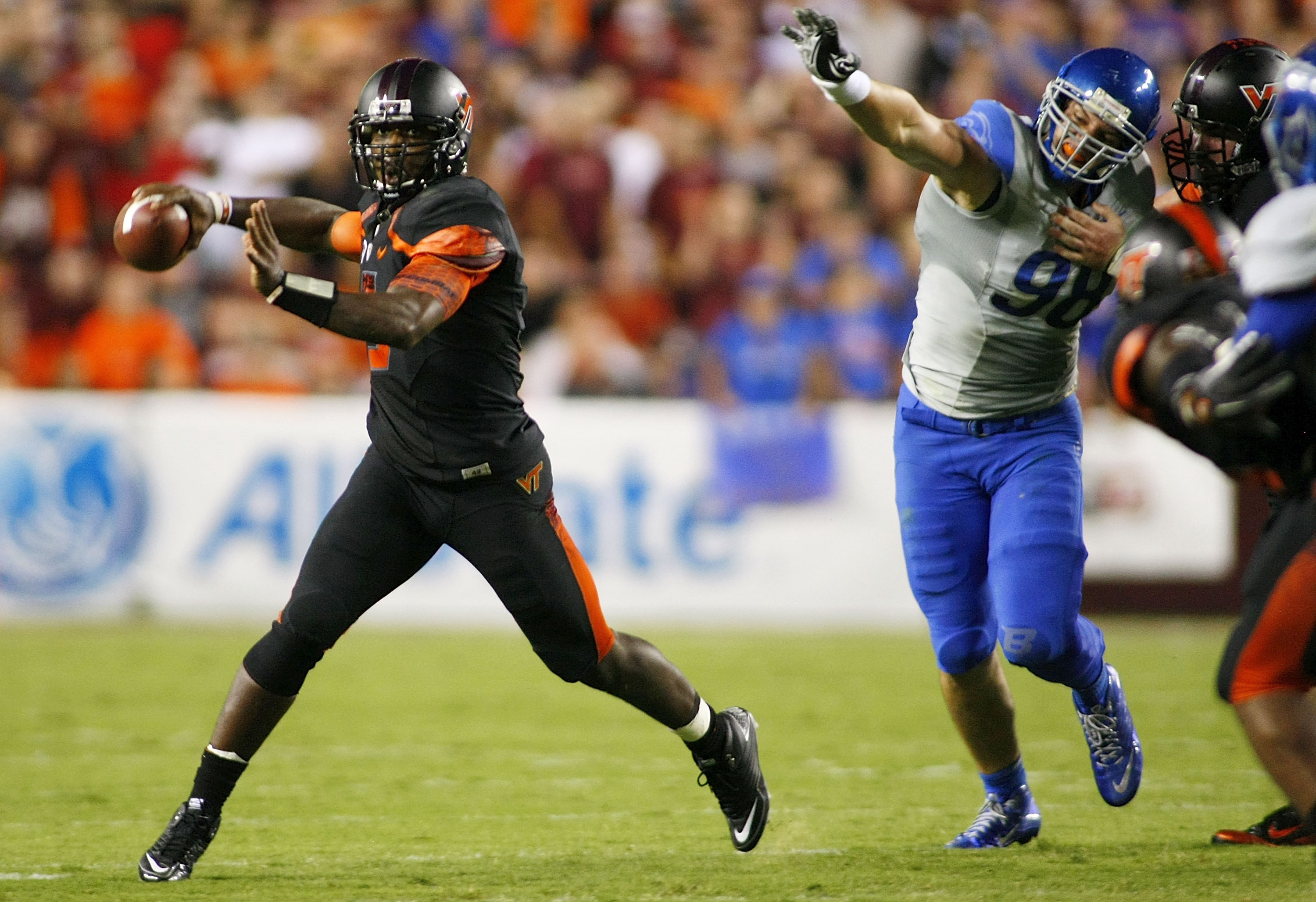 LANDOVER, MD - SEPTEMBER 06: Quarterback #5 Tyrod Taylor of the Virginia Tech Hokies throws as defensive end #98 Ryan Winterswyk of the Boise State Broncos chases at FedExField on September 6, 2010 in Landover, Maryland. (Photo by Geoff Burke/Getty Imag LANDOVER, MD - SEPTEMBER 06: Quarterback #5 Tyrod Taylor of the Virginia Tech Hokies throws as defensive end #98 Ryan Winterswyk of the Boise State Broncos chases at FedExField on September 6, 2010 in Landover, Maryland. (Photo by Geoff Burke/Getty Imag