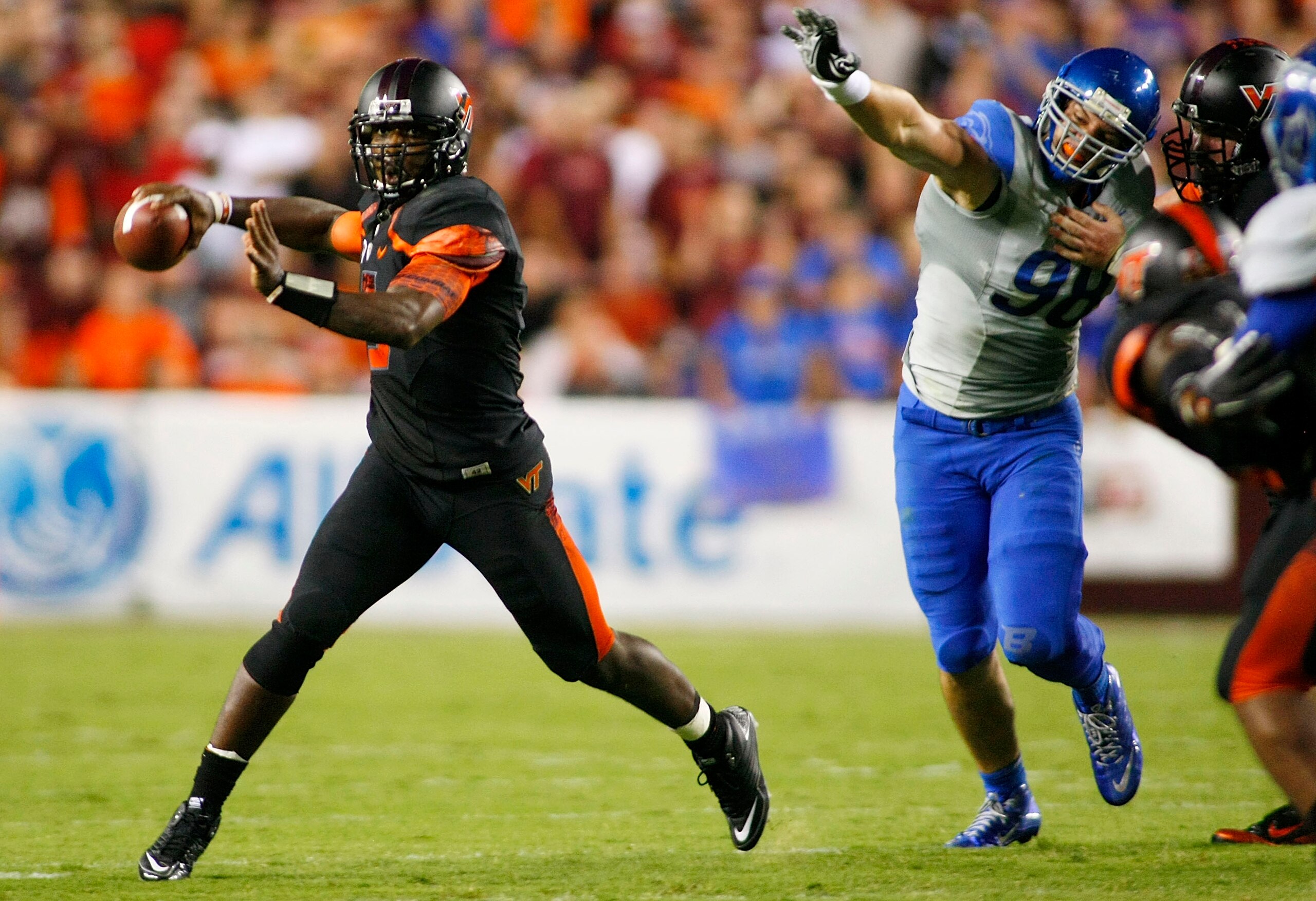 LANDOVER, MD - SEPTEMBER 06: Quarterback #5 Tyrod Taylor of the Virginia Tech Hokies throws as defensive end #98 Ryan Winterswyk of the Boise State Broncos chases at FedExField on September 6, 2010 in Landover, Maryland. (Photo by Geoff Burke/Getty Imag LANDOVER, MD - SEPTEMBER 06: Quarterback #5 Tyrod Taylor of the Virginia Tech Hokies throws as defensive end #98 Ryan Winterswyk of the Boise State Broncos chases at FedExField on September 6, 2010 in Landover, Maryland. (Photo by Geoff Burke/Getty Imag