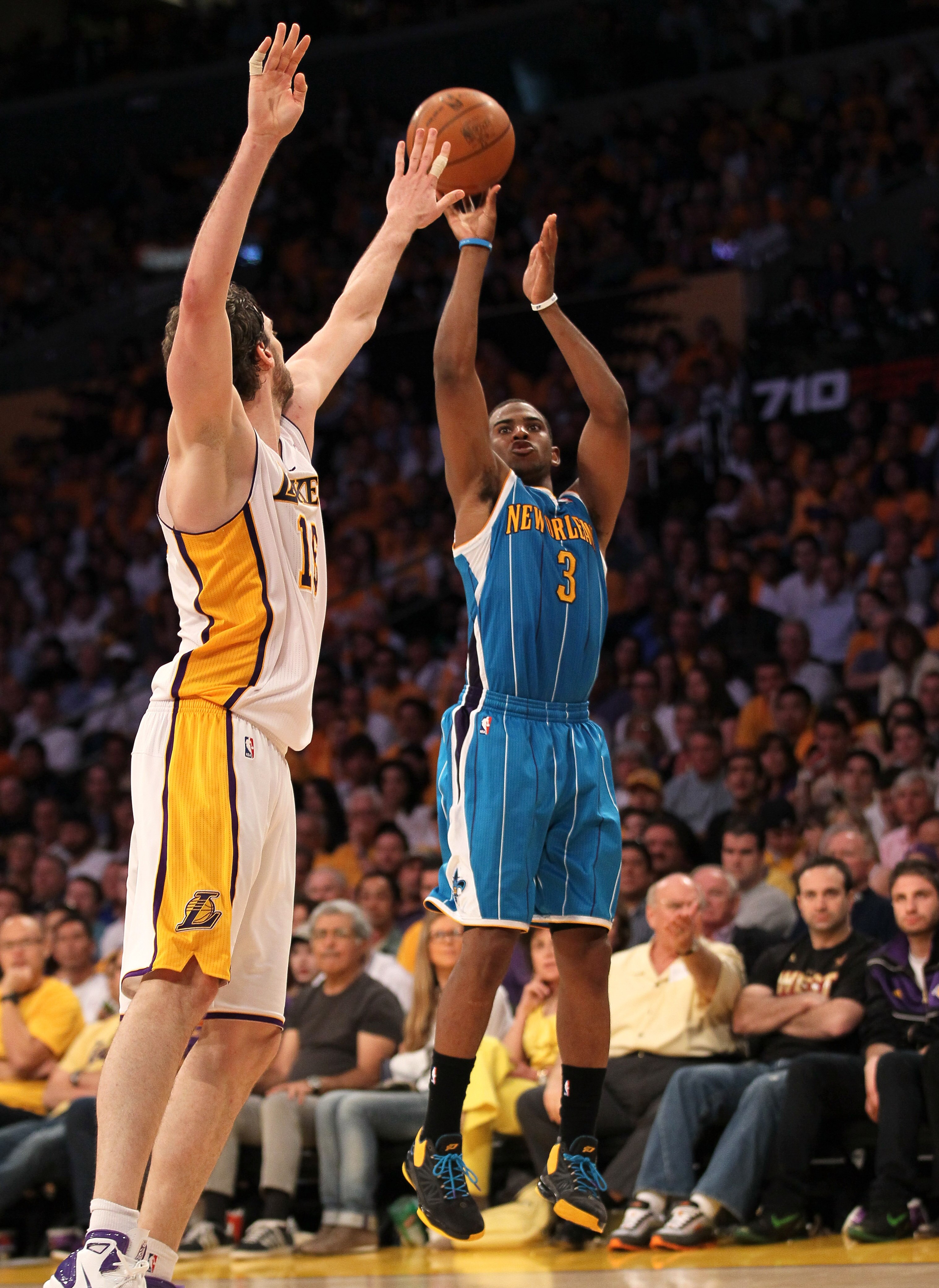 LOS ANGELES, CA - APRIL 17:  Chris Paul #3 of  the New Orleans Hornets makes a jump shot over Pau Gasol #16 of the Los Angeles Lakers in Game One of the Western Conference Quarterfinals in the 2011 NBA Playoffs on April 17, 2011 at Staples Center in Los A