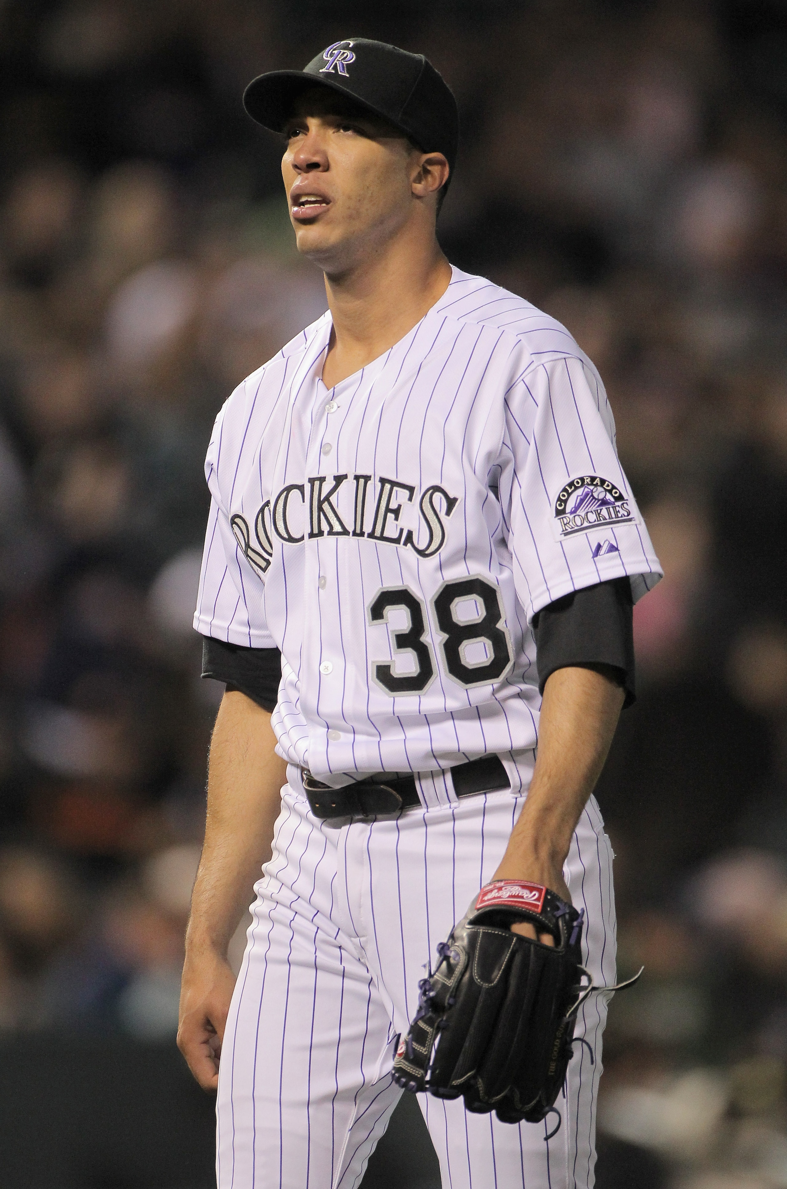 DENVER, CO - APRIL 19: Starting pitcher Ubaldo Jimenez #38 of the Colorado Rockies heads to the dugout as he faces the San Francisco Giants at Coors Field on April 19, 2011 in Denver, Colorado. Jimenez collected the loss as the Giants defeated the Rockie DENVER, CO - APRIL 19: Starting pitcher Ubaldo Jimenez #38 of the Colorado Rockies heads to the dugout as he faces the San Francisco Giants at Coors Field on April 19, 2011 in Denver, Colorado. Jimenez collected the loss as the Giants defeated the Rockie
