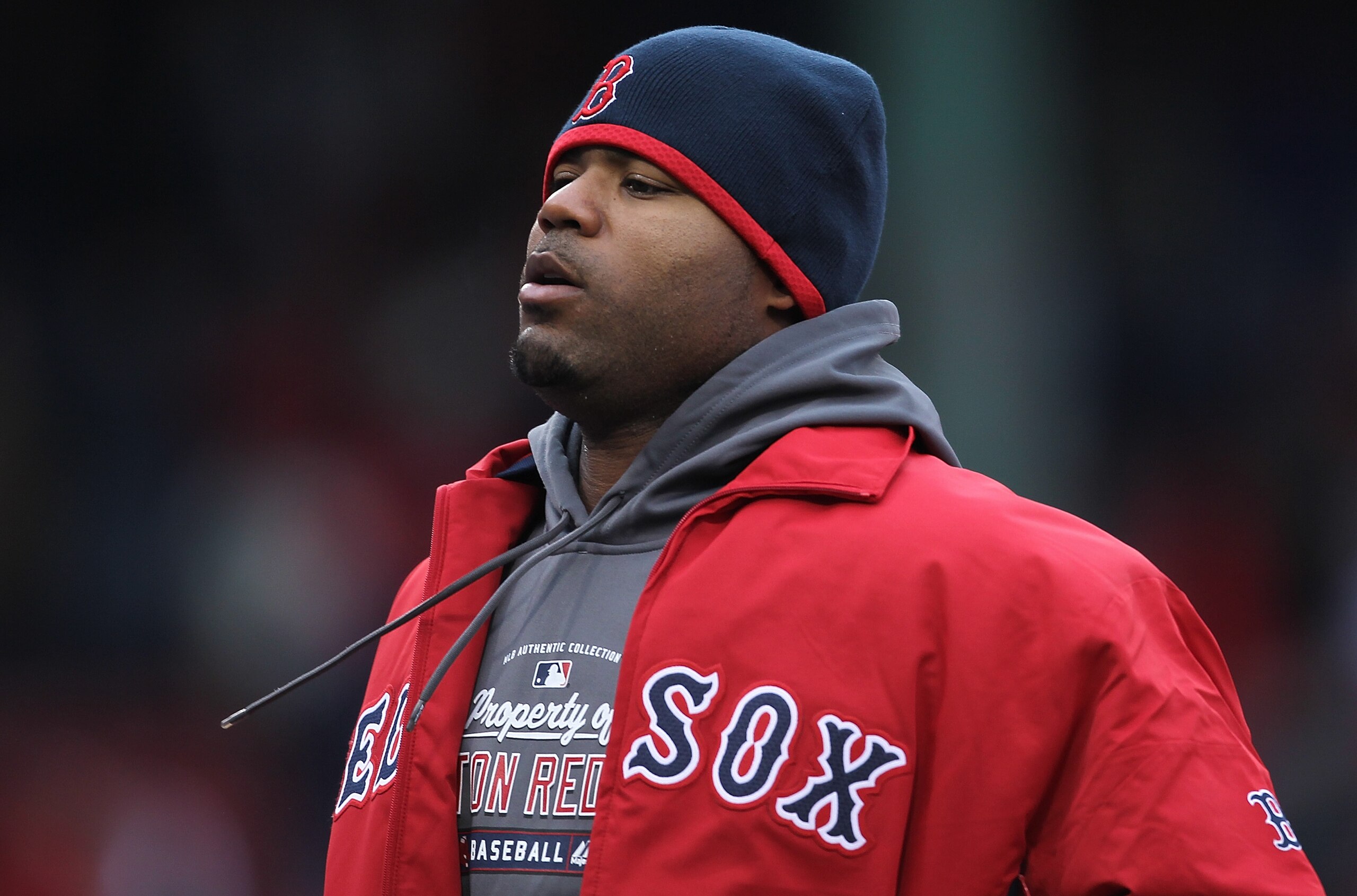 BOSTON, MA - APRIL 16, 2011:  Carl Crawford #13 of the Boston Red Sox, who did not start in the outfield, walks to the dugout after a 4-1 win against the Toronto Blue Jays at Fenway Park April 16, 2011 in Boston, Massachusetts. (Photo by Jim Rogash/Getty