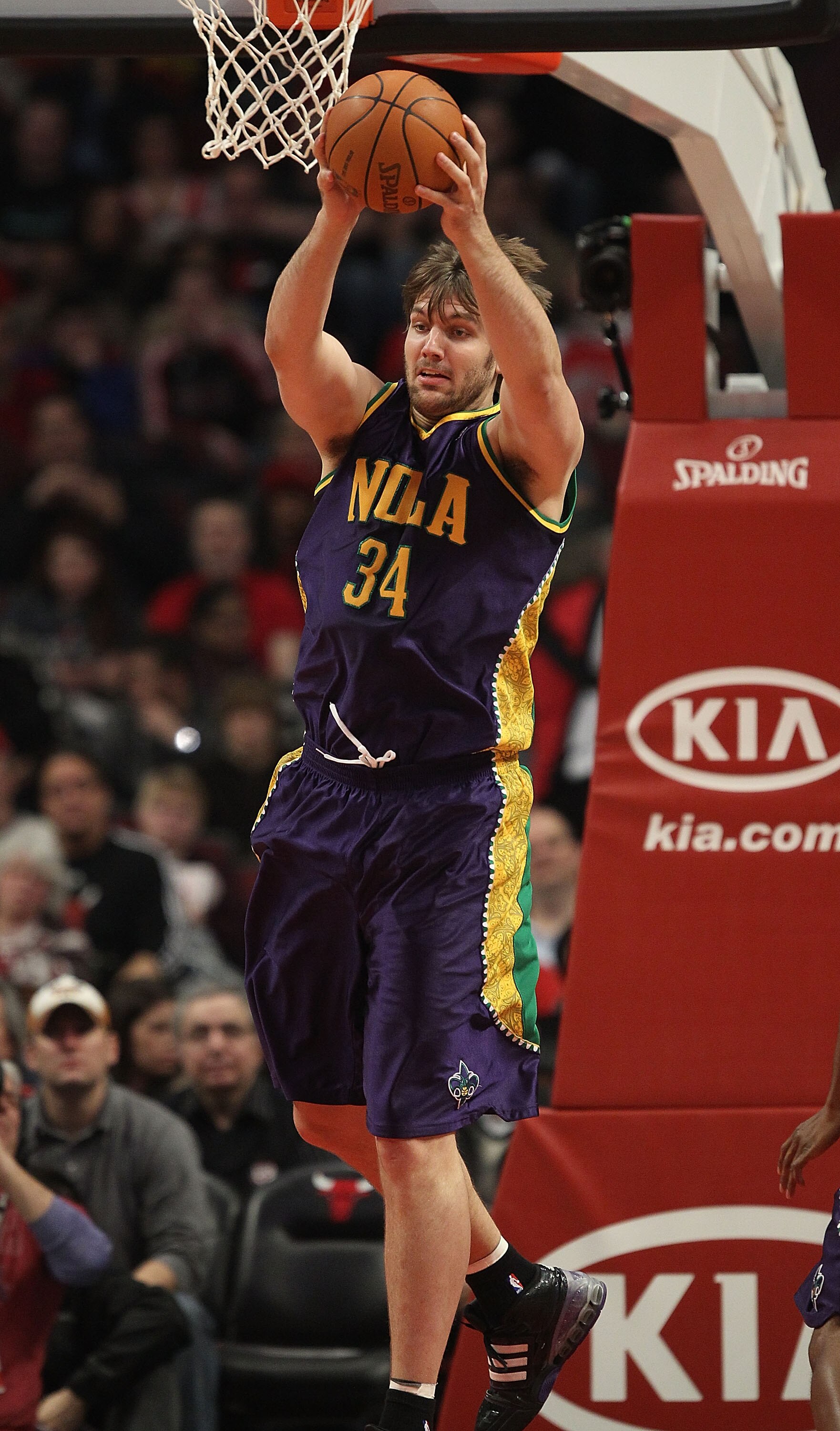 CHICAGO, IL - MARCH 07: Aaron Gray #34 of the New Orleans Hornets grabs a rebound against the Chicago Bulls at the United Center on March 7, 2011 in Chicago, Illinois. The Bulls defeated the Hornets 85-77. NOTE TO USER: User expressly acknowledges and agr