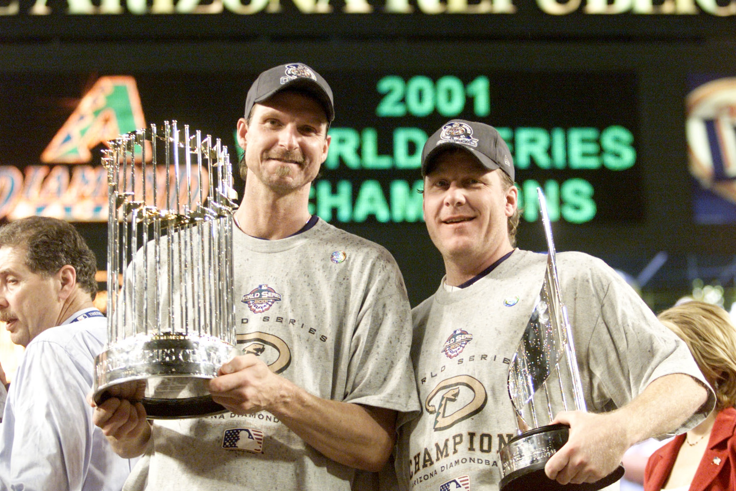 4 Nov 2001: Co-MVP winners Randy Johnson #51 and Curt Schilling #38 of the Arizona Diamondbacks hold the trophys after winning the World Series over the New York Yankees at Bank One Ballpark in Phoenix, Arizona. The Diamondbacks defeated the Yankees 3-2 4 Nov 2001: Co-MVP winners Randy Johnson #51 and Curt Schilling #38 of the Arizona Diamondbacks hold the trophys after winning the World Series over the New York Yankees at Bank One Ballpark in Phoenix, Arizona. The Diamondbacks defeated the Yankees 3-2