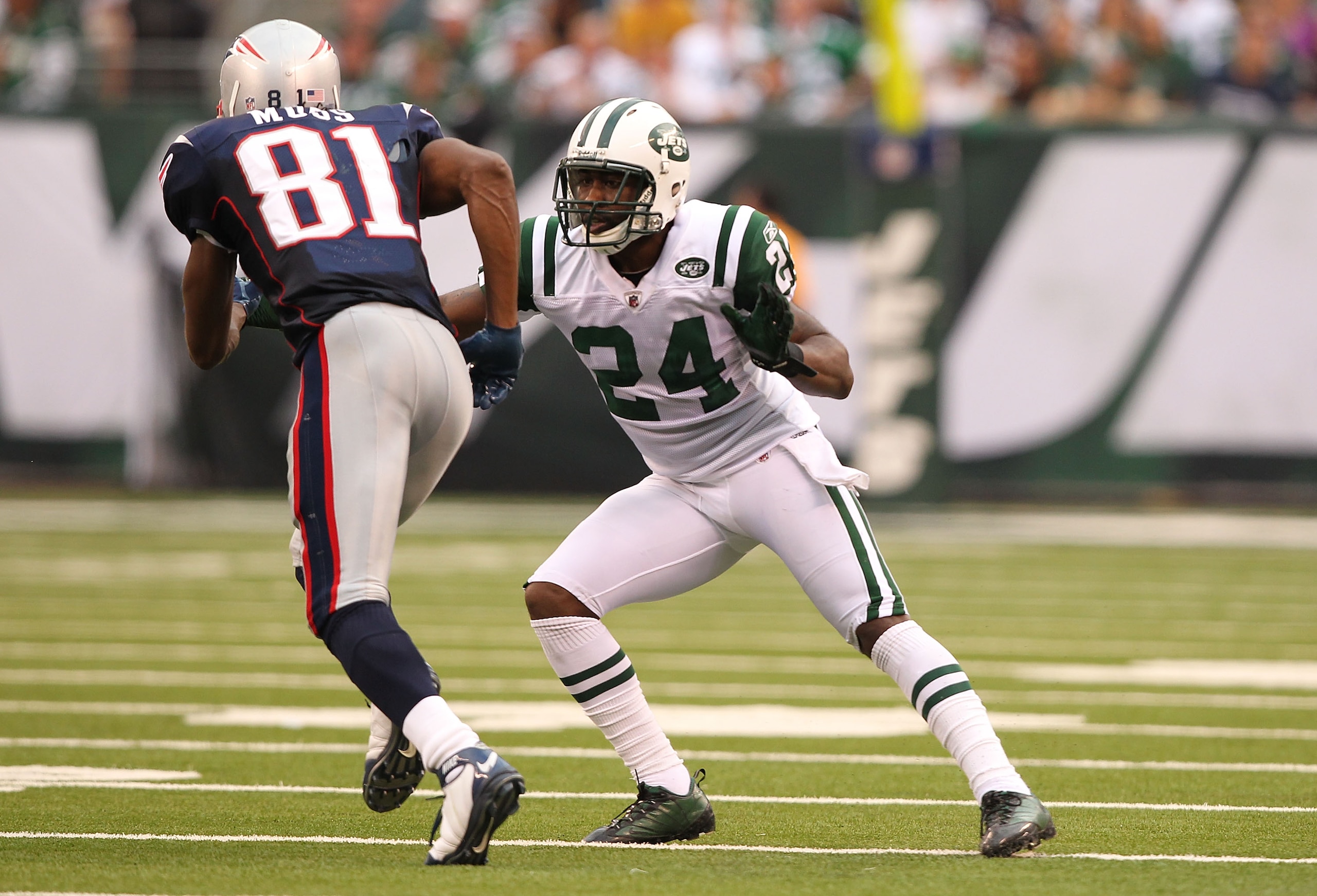 EAST RUTHERFORD, NJ - SEPTEMBER 19:  Darrelle Revis #24 of the New York Jets defends against Randy Moss #81 of the New England Patriots during their  game on September 19, 2010 at the New Meadowlands Stadium  in East Rutherford, New Jersey.  (Photo by Al 