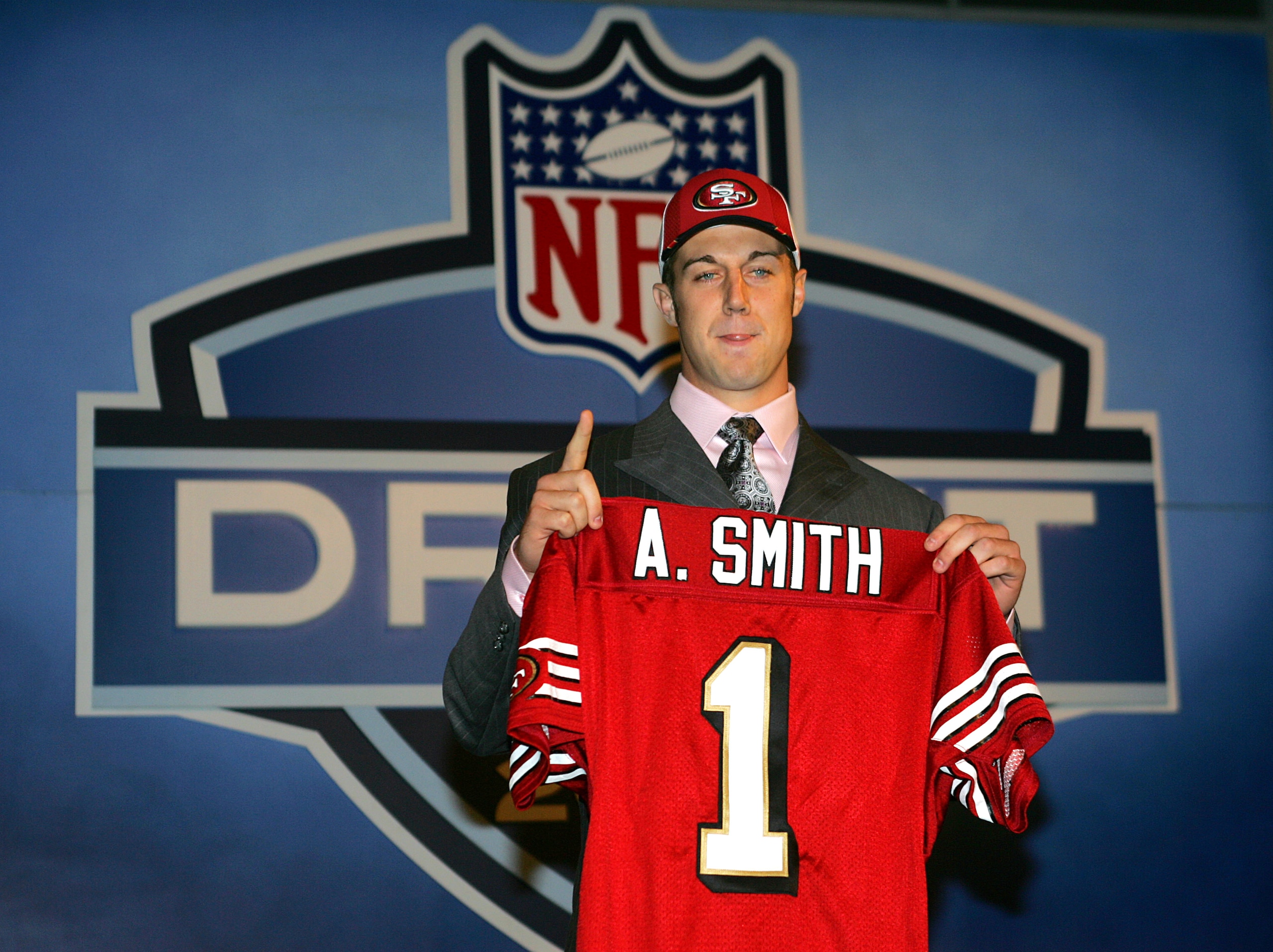 NEW YORK CITY - APRIL 23:  Quarterback Alex Smith (Utah) poses with his jersey during the 70th NFL Draft on April 23, 2005 at the Jacob K. Javits Convention Center in New York City. Smith was drafted first overall by the San Francisco 49ers.  (Photo by Ch