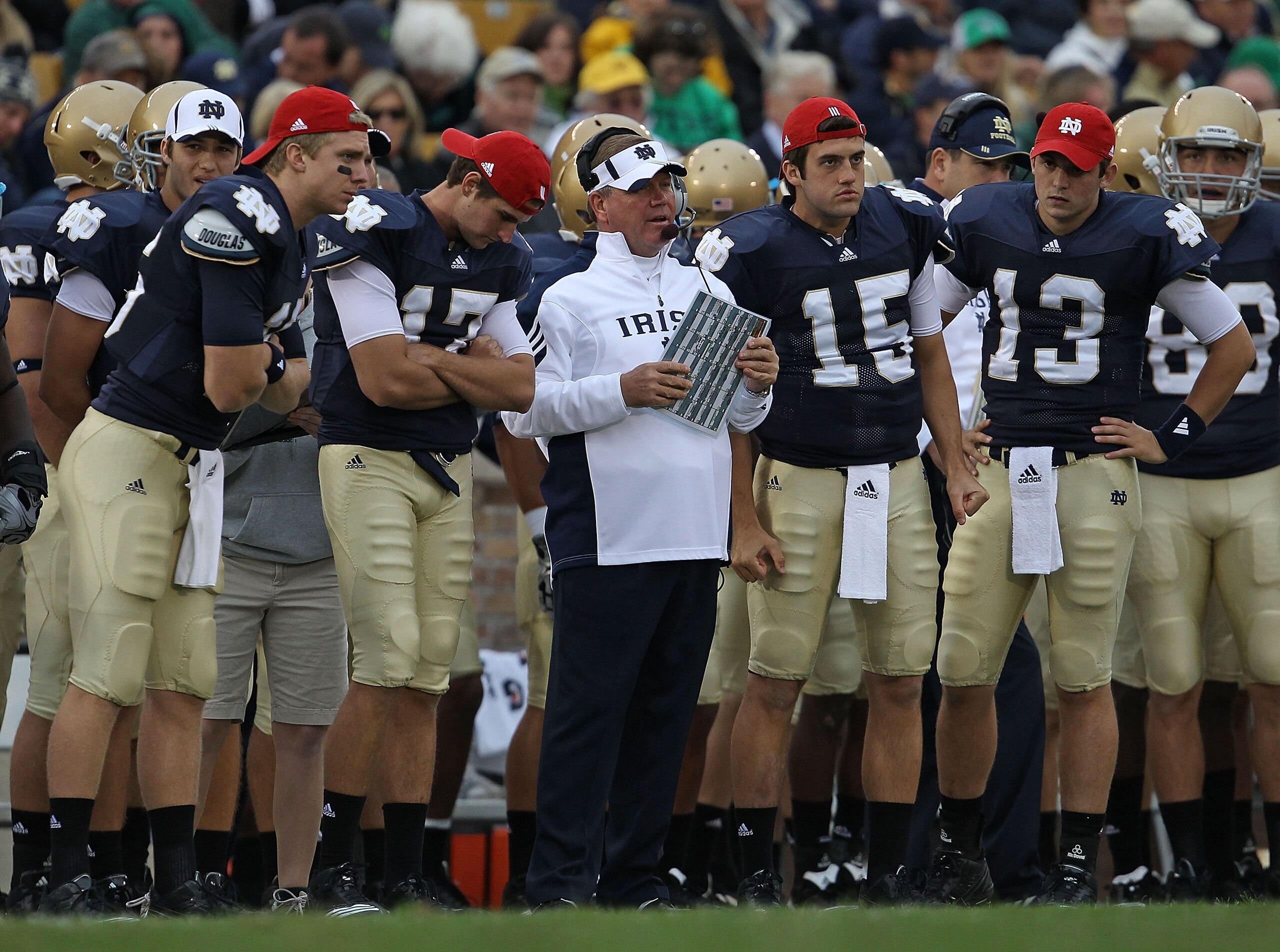 SOUTH BEND, IN - SEPTEMBER 25: Head coach Brian Kelly of the Notre Dame Fighting Irish along with quarterbacks (L-R) Nate Montana #16, Matthew Mulvey #17, Brian Castello and Tommy Rees #13 watch as their team takes on the Stanford Cardinal at Notre Dame S SOUTH BEND, IN - SEPTEMBER 25: Head coach Brian Kelly of the Notre Dame Fighting Irish along with quarterbacks (L-R) Nate Montana #16, Matthew Mulvey #17, Brian Castello and Tommy Rees #13 watch as their team takes on the Stanford Cardinal at Notre Dame S