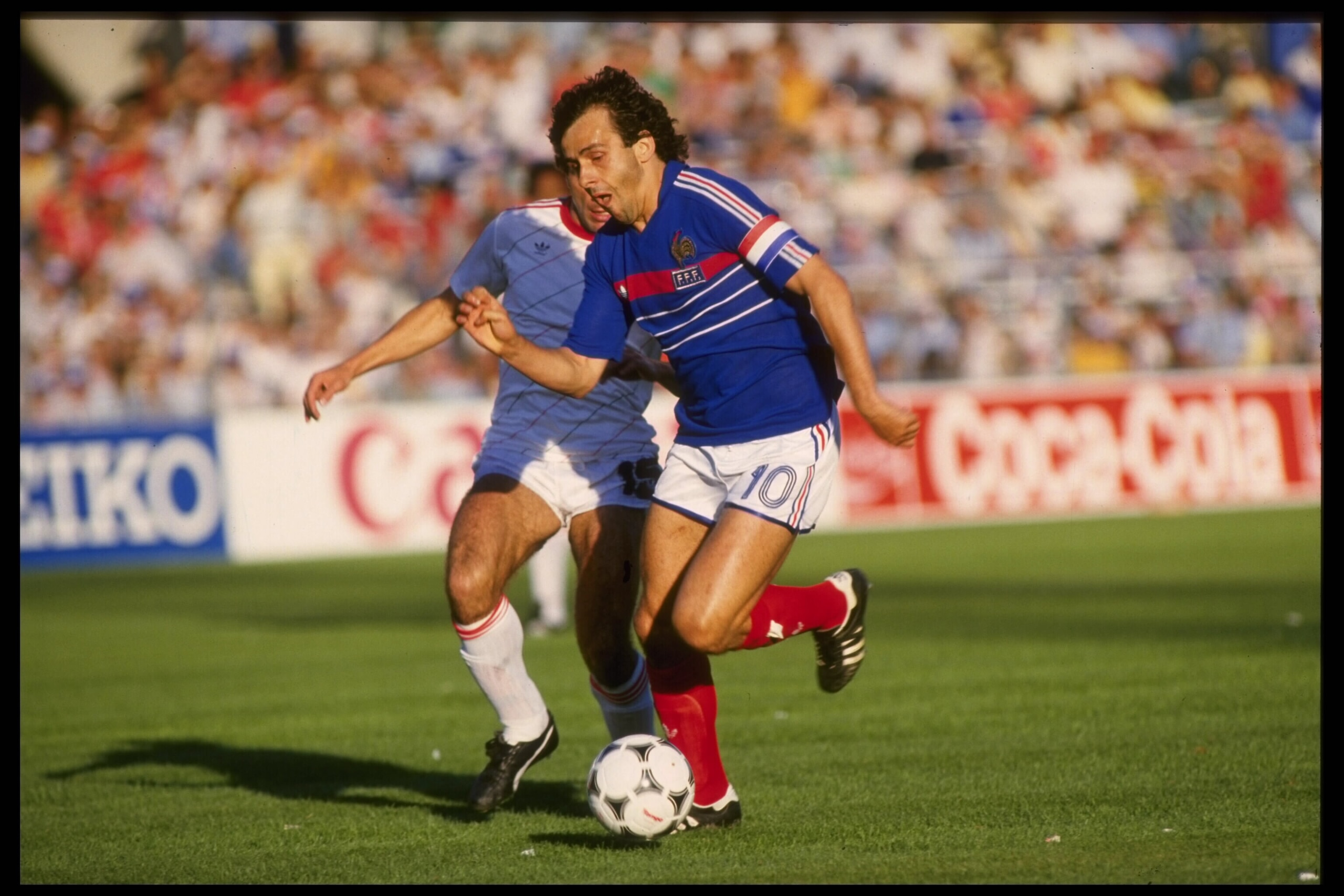 Jun 1984:  Michel Platini of France on the ball in the game against Portugal during the memorable semi-final of the European nations cup which was held in France. The match went in to extra time and France came from behind to win the game by 3-2.Mandatory