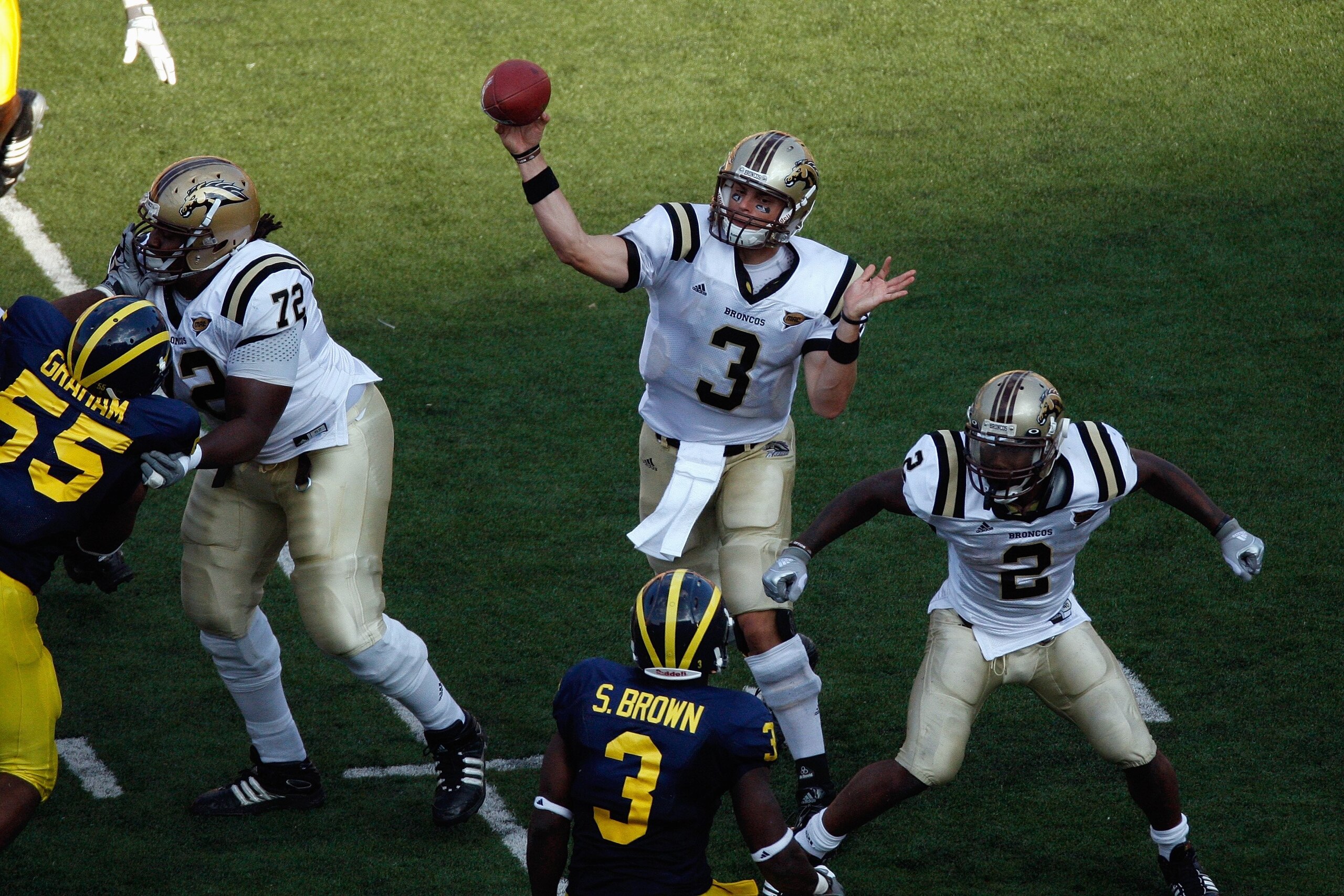 ANN ARBOR, MI - SEPTEMBER 5: Tim Hiller #3 of the Western Michigan Broncos passes as Anthony Parker #72 and Brandon West #2 block during the game against the Michigan Wolverines on September 5, 2009 at Michigan Stadium in Ann Arbor, Michigan. (Photo by G ANN ARBOR, MI - SEPTEMBER 5: Tim Hiller #3 of the Western Michigan Broncos passes as Anthony Parker #72 and Brandon West #2 block during the game against the Michigan Wolverines on September 5, 2009 at Michigan Stadium in Ann Arbor, Michigan. (Photo by G