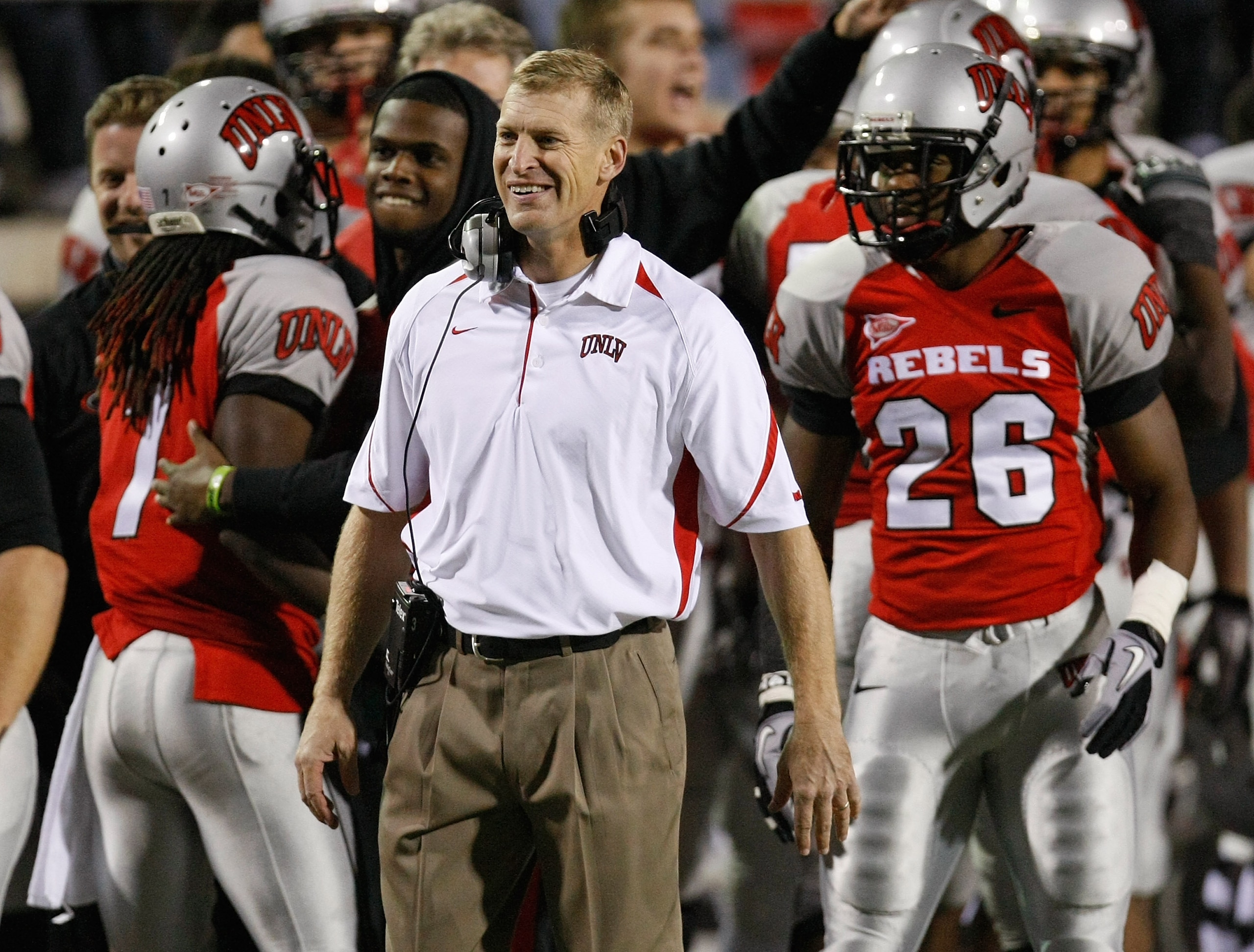 LAS VEGAS - NOVEMBER 18: Head coach Bobby Hauck of the UNLV Rebels celebrates on the sideline after his team scored a touchdown against the Air Force Falcons at Sam Boyd Stadium November 18, 2010 in Las Vegas, Nevada. Air Force won 35-20. (Photo by Etha LAS VEGAS - NOVEMBER 18: Head coach Bobby Hauck of the UNLV Rebels celebrates on the sideline after his team scored a touchdown against the Air Force Falcons at Sam Boyd Stadium November 18, 2010 in Las Vegas, Nevada. Air Force won 35-20. (Photo by Etha