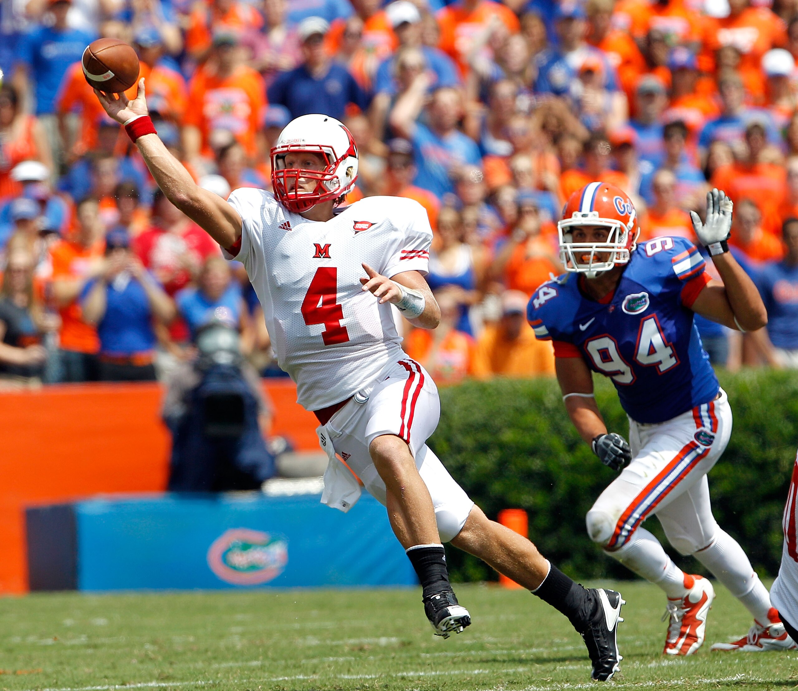 GAINESVILLE, FL - SEPTEMBER 04: Zac Dysert #4 of the Miami University RedHawks attempts a pass while being pressured by Justin Trattou #94 of the Florida Gators at Ben Hill Griffin Stadium on September 4, 2010 in Gainesville, Florida. (Photo by Sam Gree GAINESVILLE, FL - SEPTEMBER 04: Zac Dysert #4 of the Miami University RedHawks attempts a pass while being pressured by Justin Trattou #94 of the Florida Gators at Ben Hill Griffin Stadium on September 4, 2010 in Gainesville, Florida. (Photo by Sam Gree