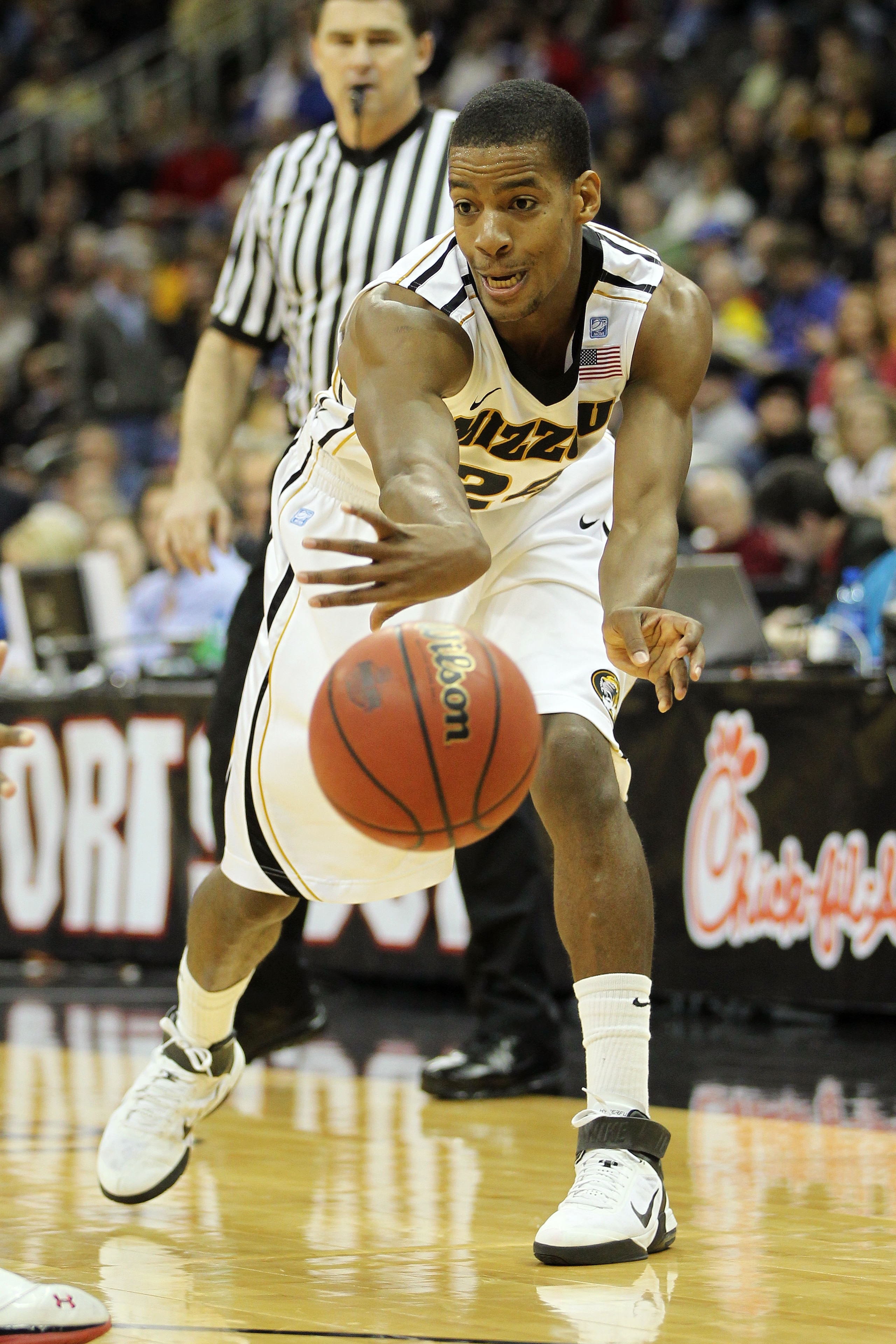 KANSAS CITY, MO - MARCH 09:  Kim English #24 of the Missouri Tigers passes the ball against the Texas Tech Red Raiders during their game in the first round of the 2011 Phillips 66 Big 12 Men's Basketball Tournament at Sprint Center on March 9, 2011 in Kan