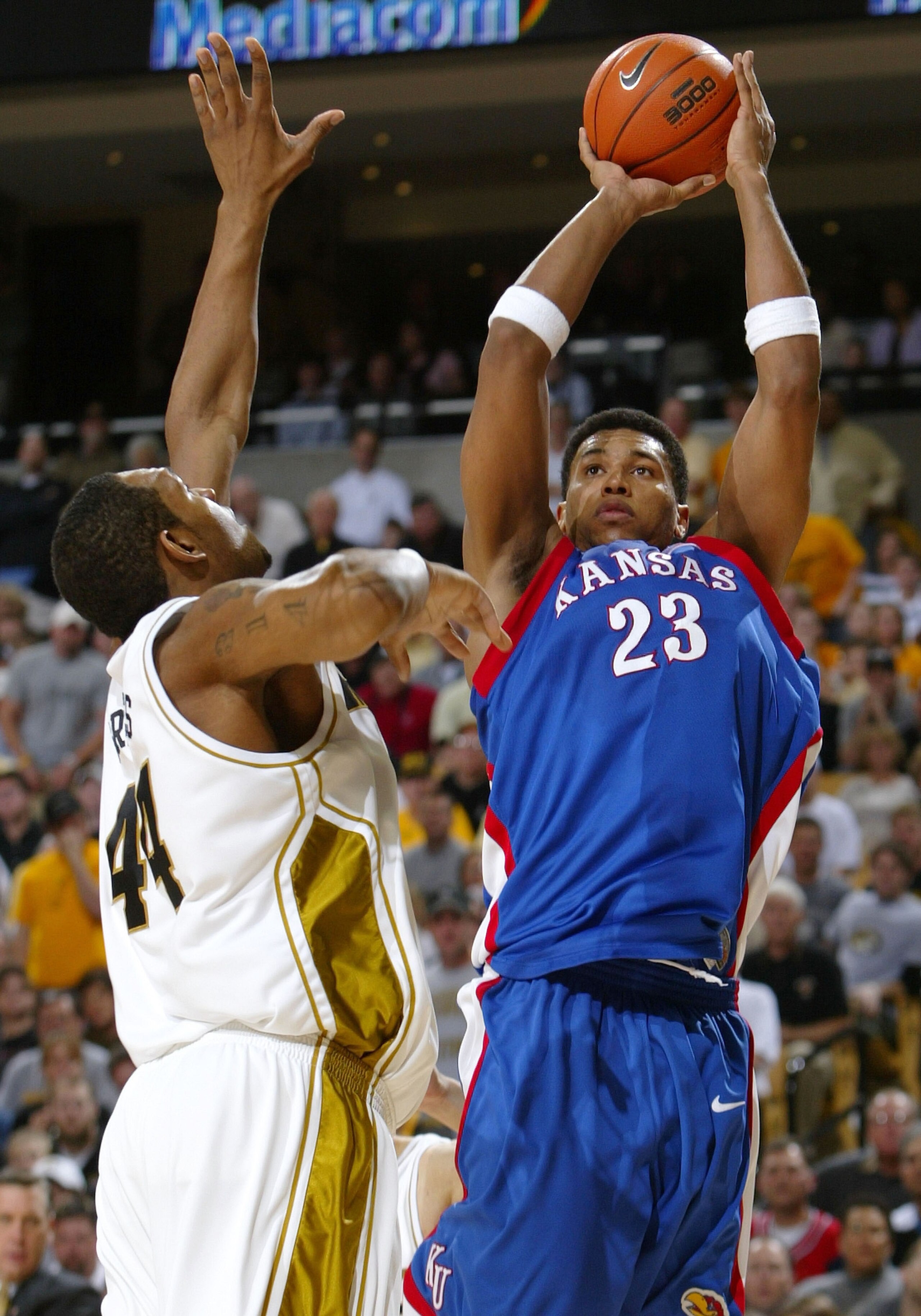 COLUMBIA, MO - MARCH 6:  Wayne Simien #23 of the Kansas Jayhawks takes a shot as Kalen Grimes #44 of the Missouri Tigers defends on March 6, 2005 at Mizzou Arena in Columbia, Missouri.  (Photo by Elsa/Getty Images)