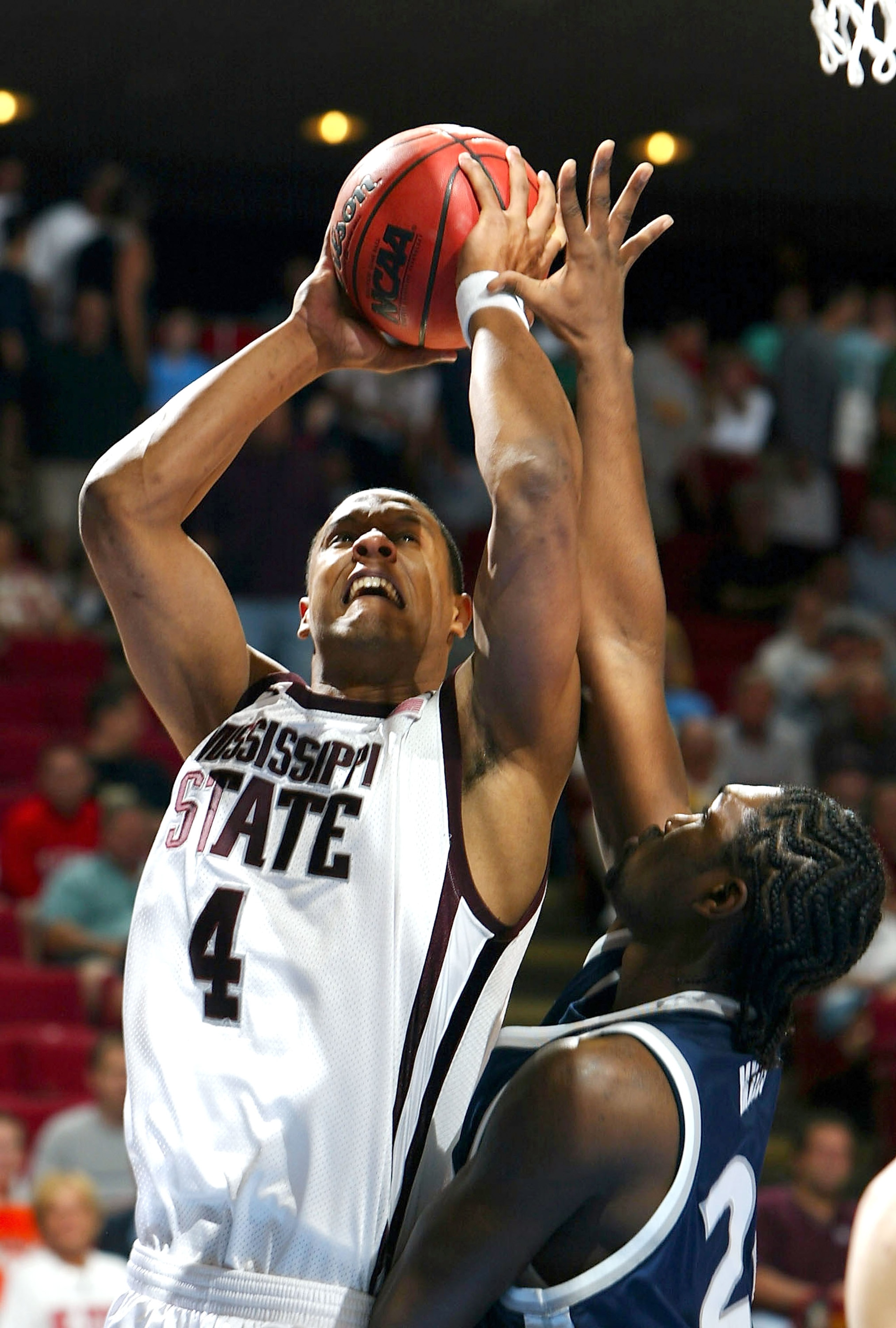 ORLANDO, FL - MARCH 21:  Lawrence Roberts #4 of the Mississippi State Bulldogs shoots over Anthony Myles #24 of the Xavier Muskateers during the second round game of the NCAA Division I Men's Basketball Tournament on March 21, 2004 at TD Waterhouse Centre