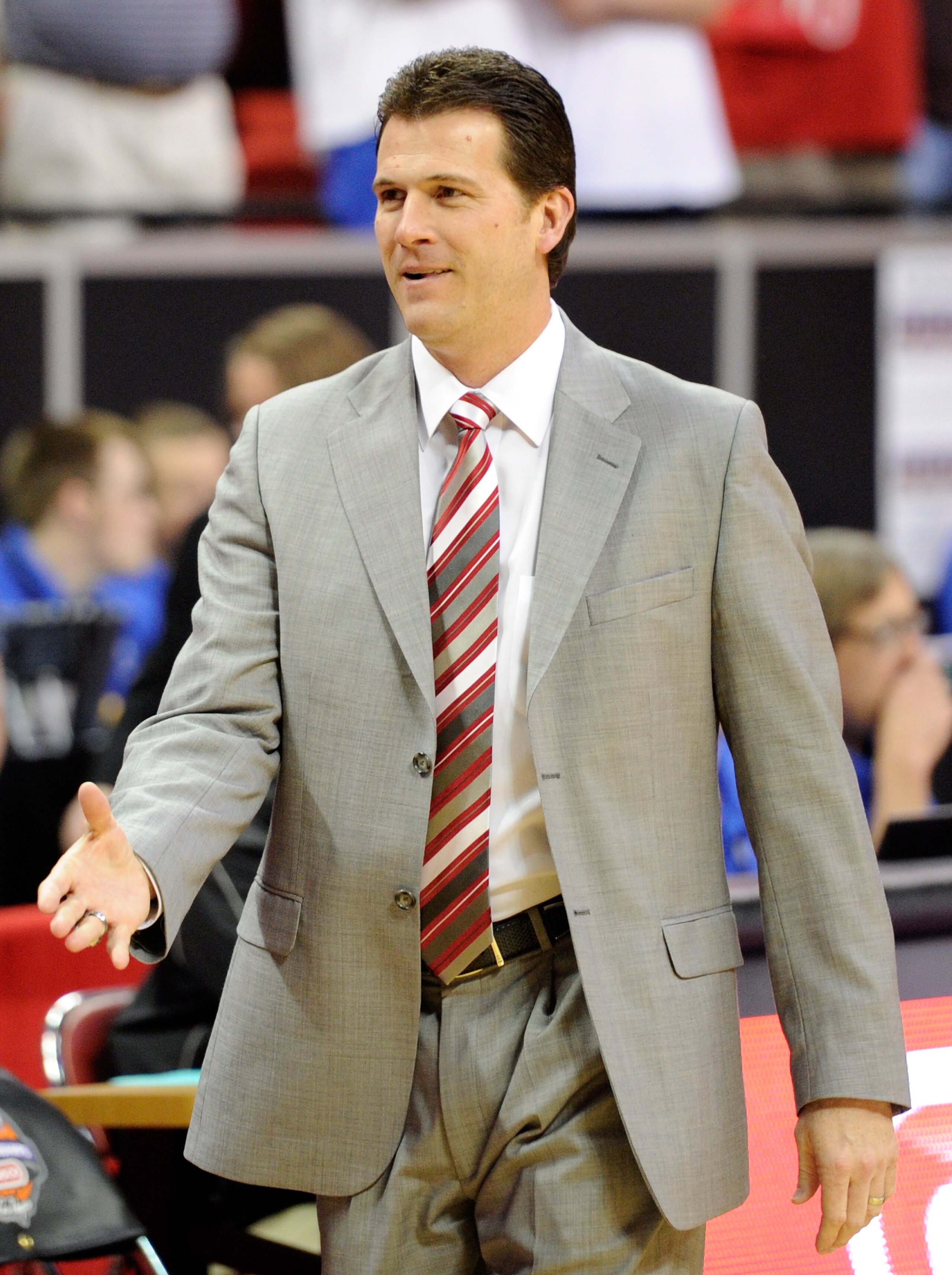LAS VEGAS, NV - MARCH 11:  Head coach Steve Alford of the New Mexico Lobos greets players before his team's 87-76 loss to the Brigham Young University Cougars in a semifinal game of the Conoco Mountain West Conference Basketball tournament at the Thomas &