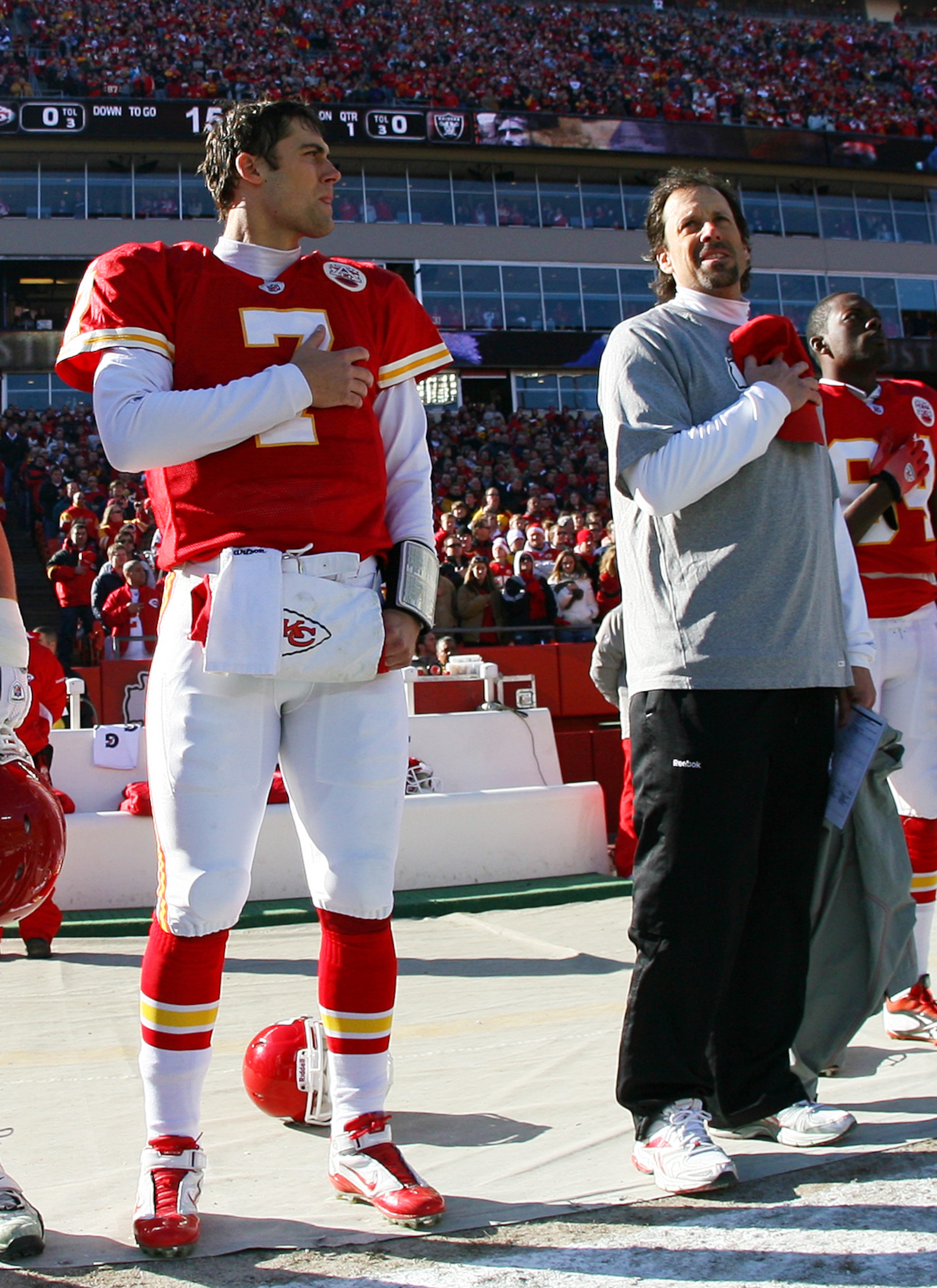 KANSAS CITY, MO - JANUARY 02:  Quarterback Matt Cassel #7 and head coach Todd Haley of the Kansas City Chiefs observe the national anthem before a game against the Oakland Raiders at Arrowhead Stadium on January 2, 2011 in Kansas City, Missouri.  (Photo b