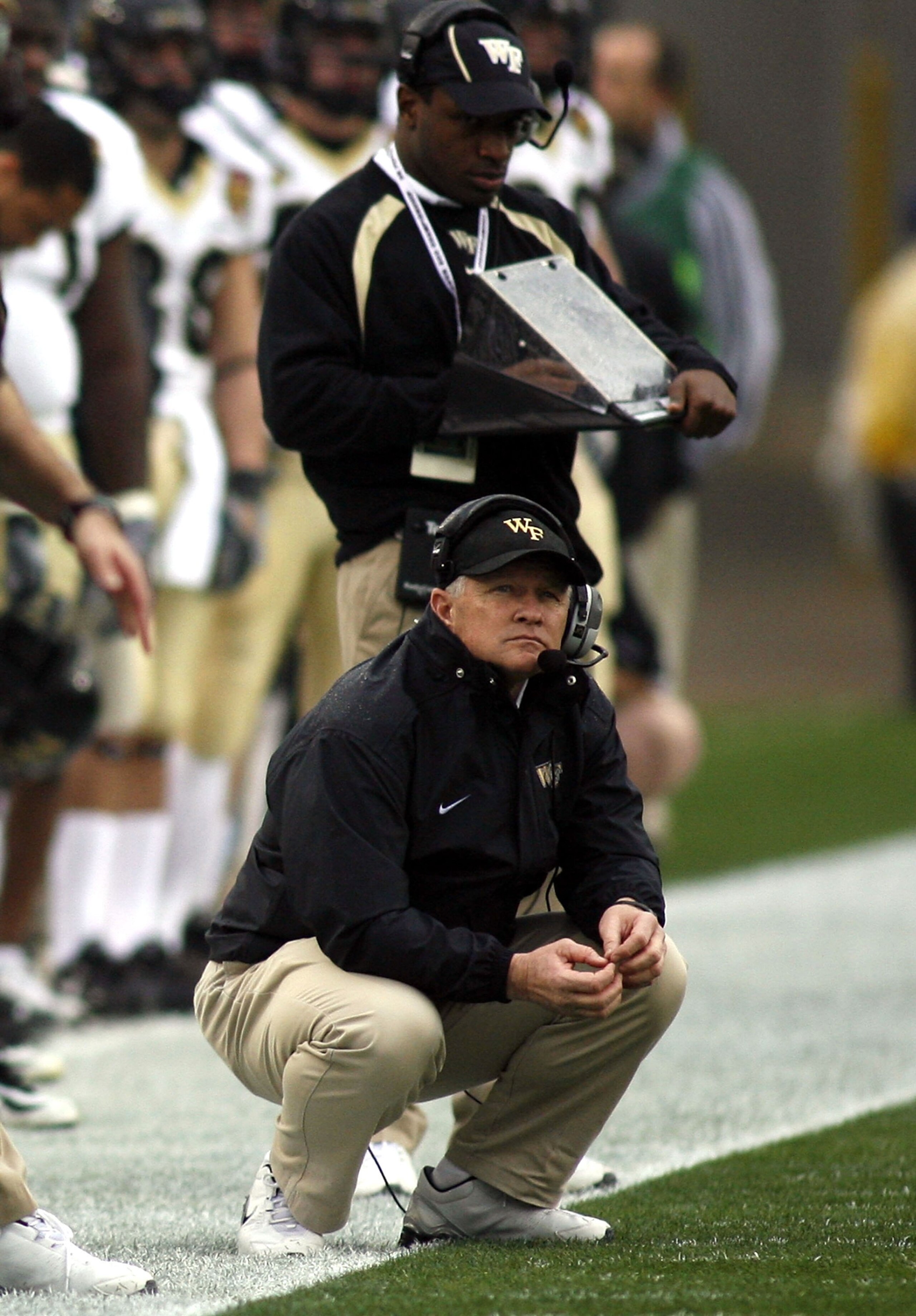 JACKSONVILLE, FL - DECEMBER 02: Head coach Jim Grobe of the Wake Forest Demon Deacons keels on the sidelines during a game against the Georgia Tech Yellow Jackets during the Atlantic Coast Conference Championship on December 2, 2006 at Alltel Stadium in JACKSONVILLE, FL - DECEMBER 02: Head coach Jim Grobe of the Wake Forest Demon Deacons keels on the sidelines during a game against the Georgia Tech Yellow Jackets during the Atlantic Coast Conference Championship on December 2, 2006 at Alltel Stadium in
