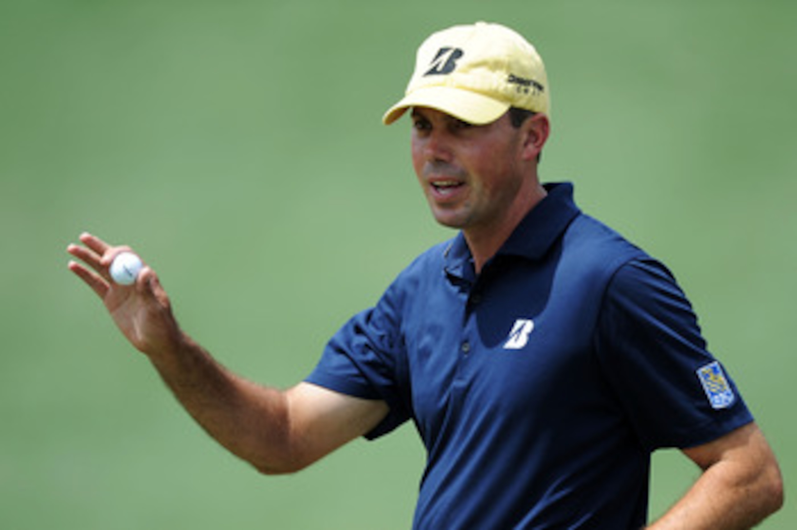 AUGUSTA, GA - APRIL 08:  Matt Kuchar waves to the crowd on the second green during the second round of the 2011 Masters Tournament at Augusta National Golf Club on April 8, 2011 in Augusta, Georgia.  (Photo by Harry How/Getty Images)