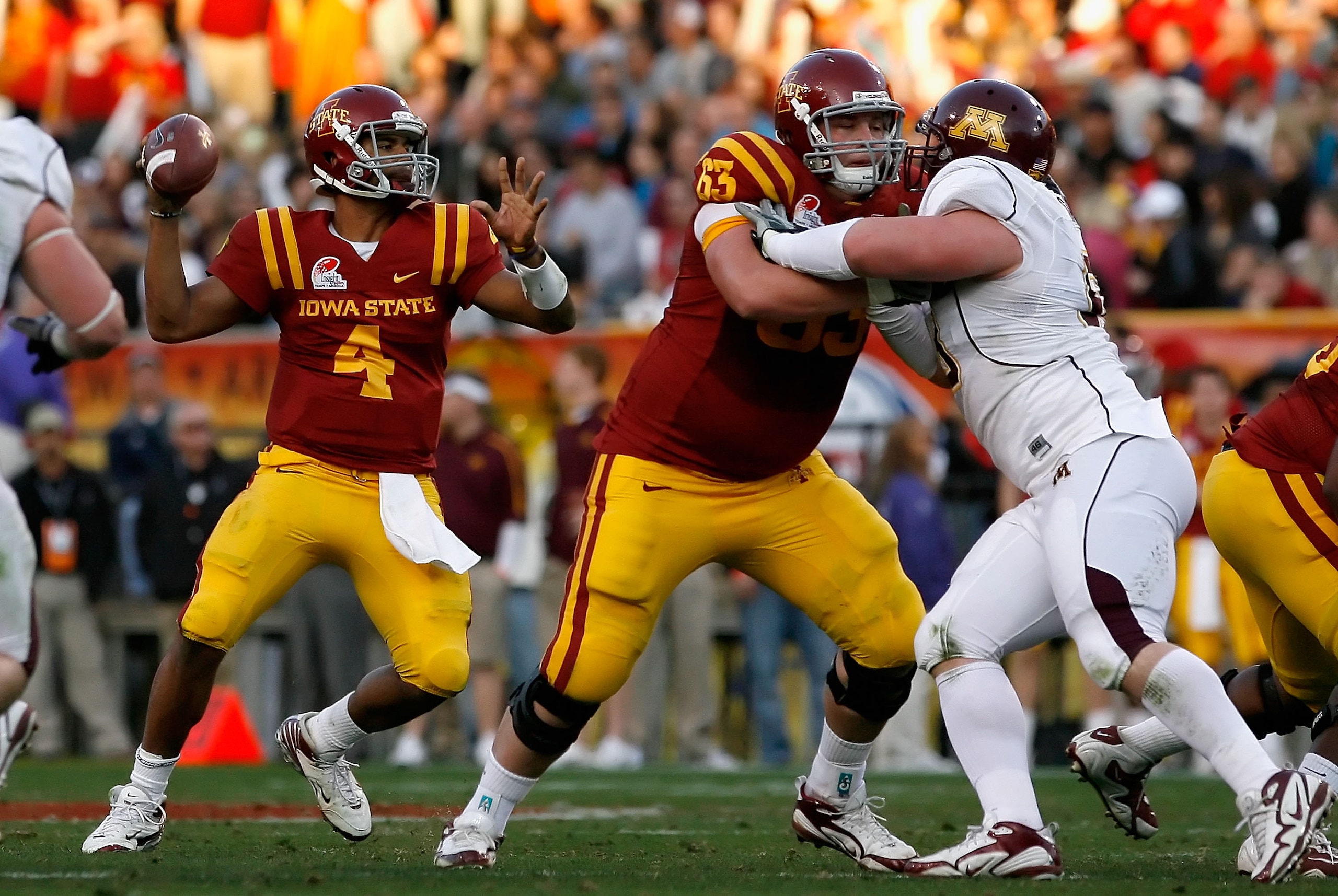 TEMPE, AZ - DECEMBER 31: Quarterback Austen Arnaud #4 of the Iowa State Cyclones drops back to pass against the Minnesota Golden Gophers during the Insight Bowl at Arizona Stadium on December 31, 2009 in Tempe, Arizona. The Cyclones defeated the Golden G TEMPE, AZ - DECEMBER 31: Quarterback Austen Arnaud #4 of the Iowa State Cyclones drops back to pass against the Minnesota Golden Gophers during the Insight Bowl at Arizona Stadium on December 31, 2009 in Tempe, Arizona. The Cyclones defeated the Golden G