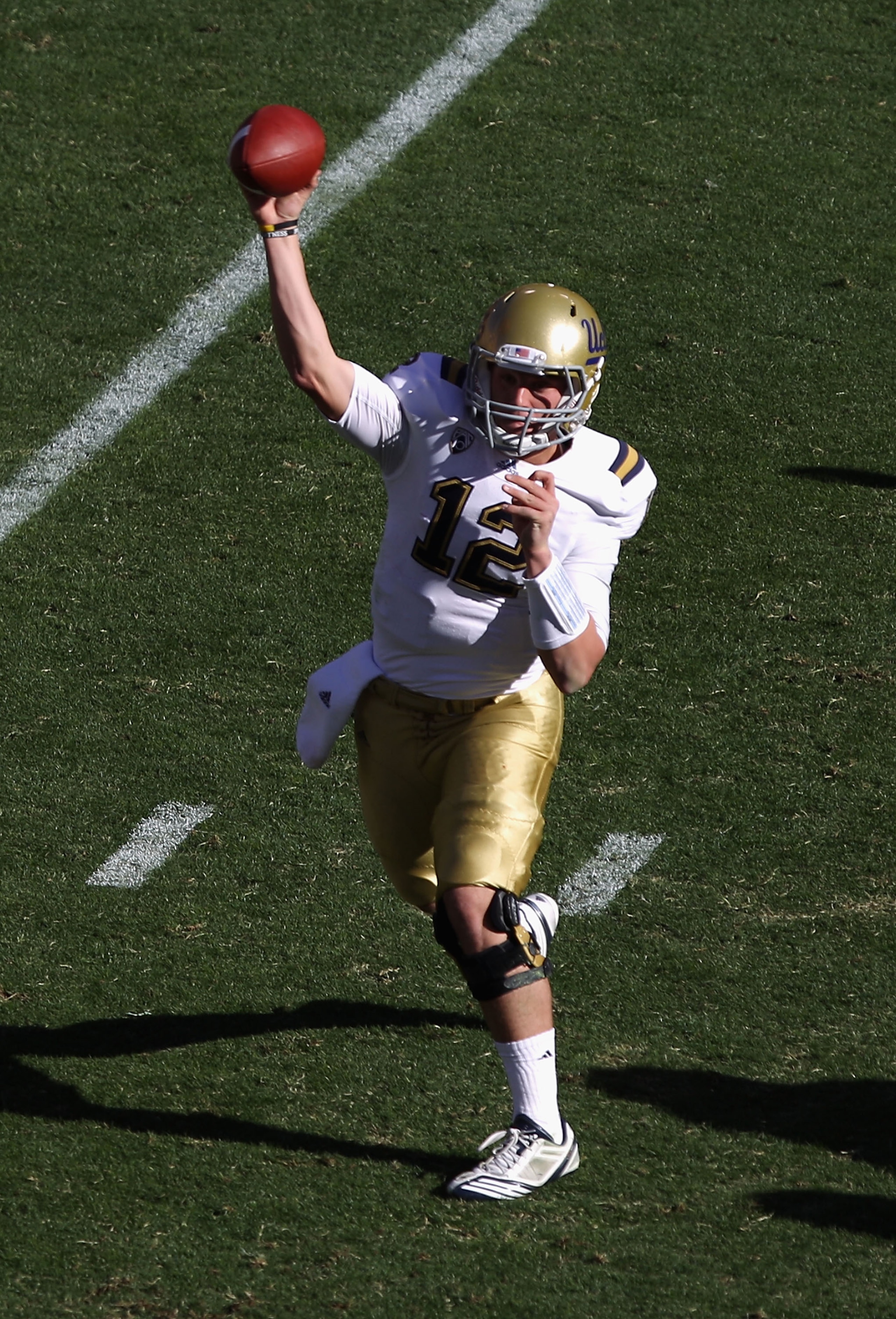 TEMPE, AZ - NOVEMBER 26: Quarterback Richard Brehaut #12 of the UCLA Bruins throws the football during the college football game against the Arizona State Sun Devils at Sun Devil Stadium on November 26, 2010 in Tempe, Arizona. The Sun Devils defeated the TEMPE, AZ - NOVEMBER 26: Quarterback Richard Brehaut #12 of the UCLA Bruins throws the football during the college football game against the Arizona State Sun Devils at Sun Devil Stadium on November 26, 2010 in Tempe, Arizona. The Sun Devils defeated the