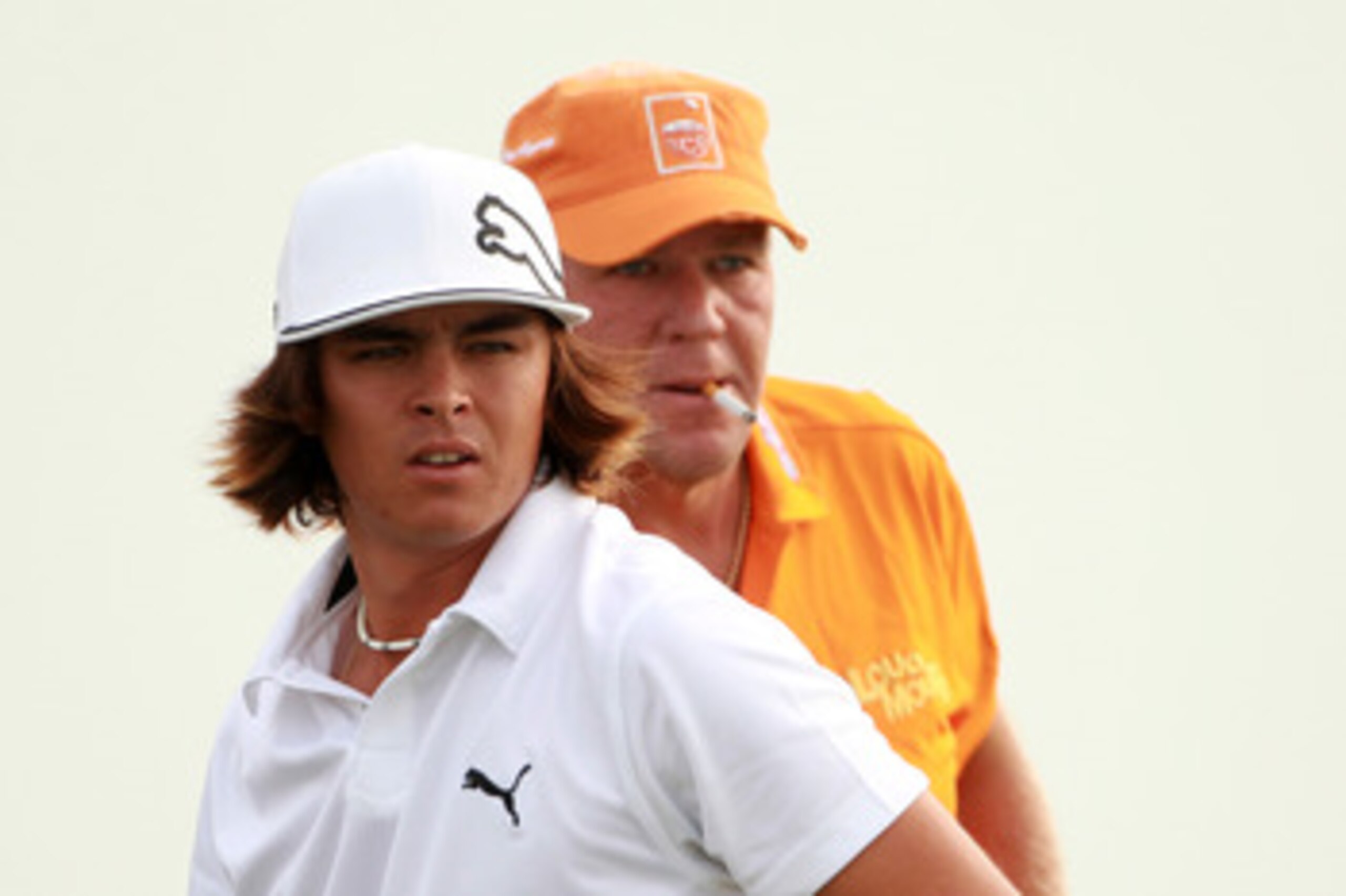 KOHLER, WI - AUGUST 10:  (L-R) Rickie Fowler and John Daly look on during a practice round prior to the start of the 92nd PGA Championship on the Straits Course at Whistling Straits on August 10, 2010 in Kohler, Wisconsin.  (Photo by Andrew Redington/Gett