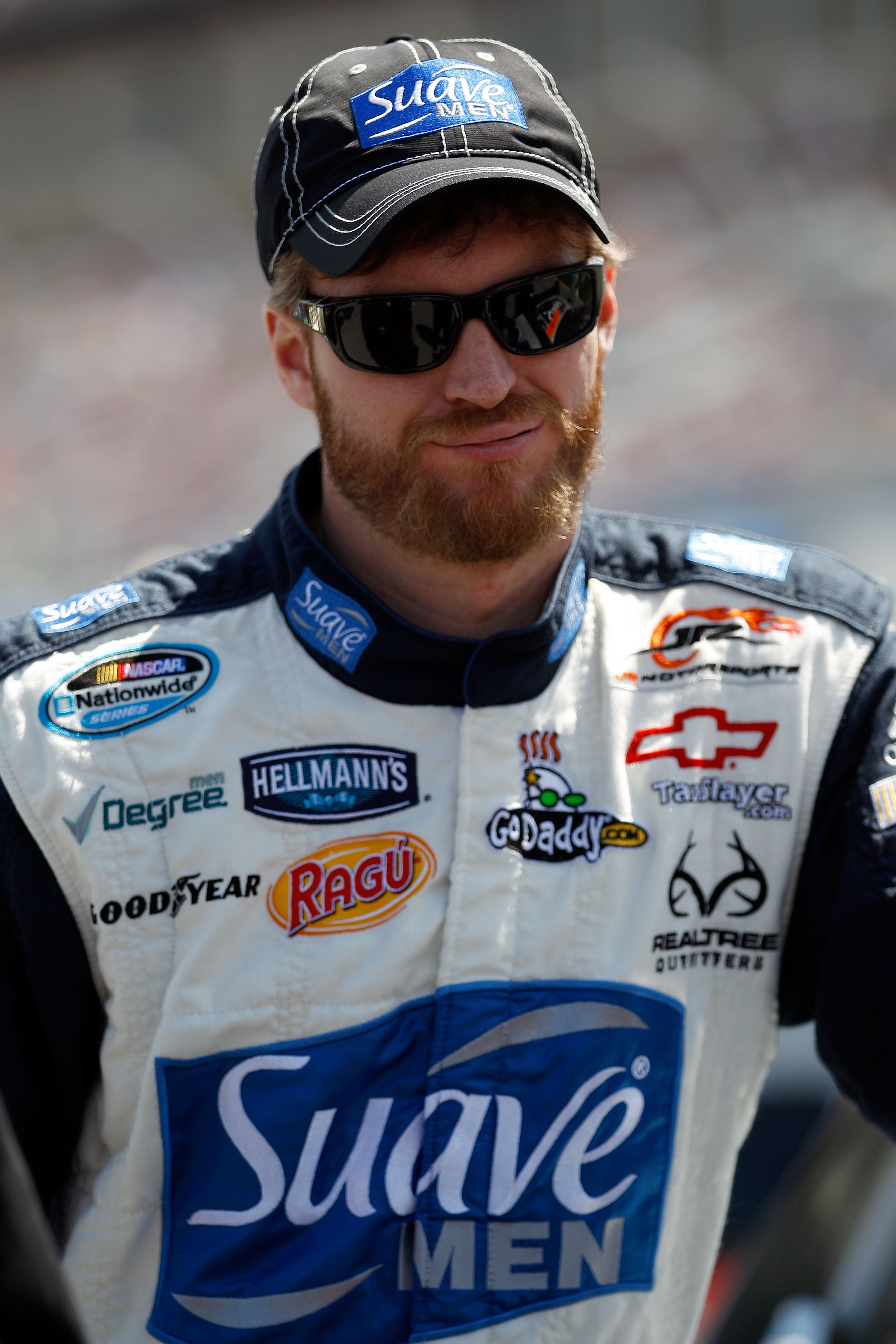 TALLADEGA, AL - APRIL 16:  Dale Earnhardt Jr., driver of the #7 Suave Men Chevrolet, stands on the grid prior to the start of the NASCAR Nationwide Series Aaron's 312 at Talladega Superspeedway on April 16, 2011 in Talladega, Alabama.  (Photo by Chris Gra