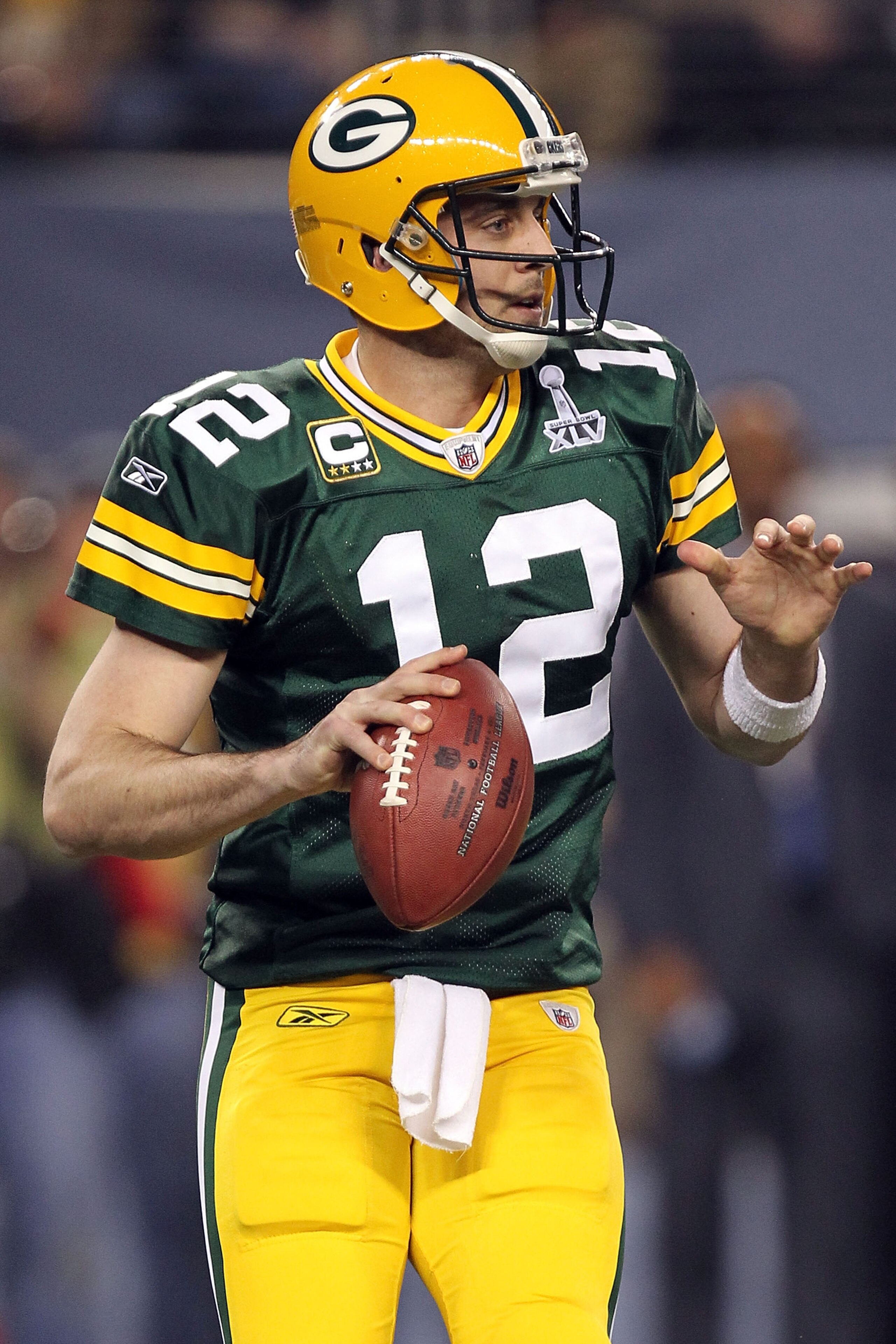 ARLINGTON, TX - FEBRUARY 06: Aaron Rodgers #12 of the Green Bay Packers drops back against the Pittsburgh Steelers during the first quarter of Super Bowl XLV at Cowboys Stadium on February 6, 2011 in Arlington, Texas. (Photo by Ronald Martinez/Getty Ima ARLINGTON, TX - FEBRUARY 06: Aaron Rodgers #12 of the Green Bay Packers drops back against the Pittsburgh Steelers during the first quarter of Super Bowl XLV at Cowboys Stadium on February 6, 2011 in Arlington, Texas. (Photo by Ronald Martinez/Getty Ima