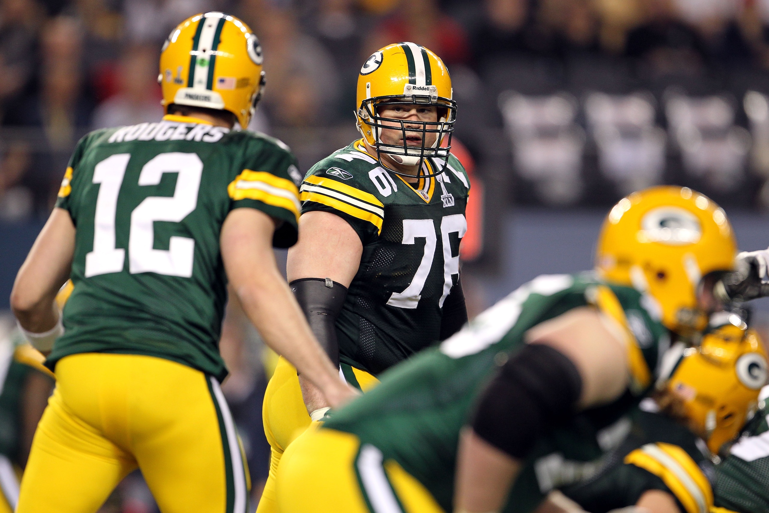 ARLINGTON, TX - FEBRUARY 06: Chad Clifton #76 of the Green Bay Packers looks back at Aaron Rodgers #12 against the Pittsburgh Steelers during Super Bowl XLV at Cowboys Stadium on February 6, 2011 in Arlington, Texas. (Photo by Jamie Squire/Getty Images) ARLINGTON, TX - FEBRUARY 06: Chad Clifton #76 of the Green Bay Packers looks back at Aaron Rodgers #12 against the Pittsburgh Steelers during Super Bowl XLV at Cowboys Stadium on February 6, 2011 in Arlington, Texas. (Photo by Jamie Squire/Getty Images)