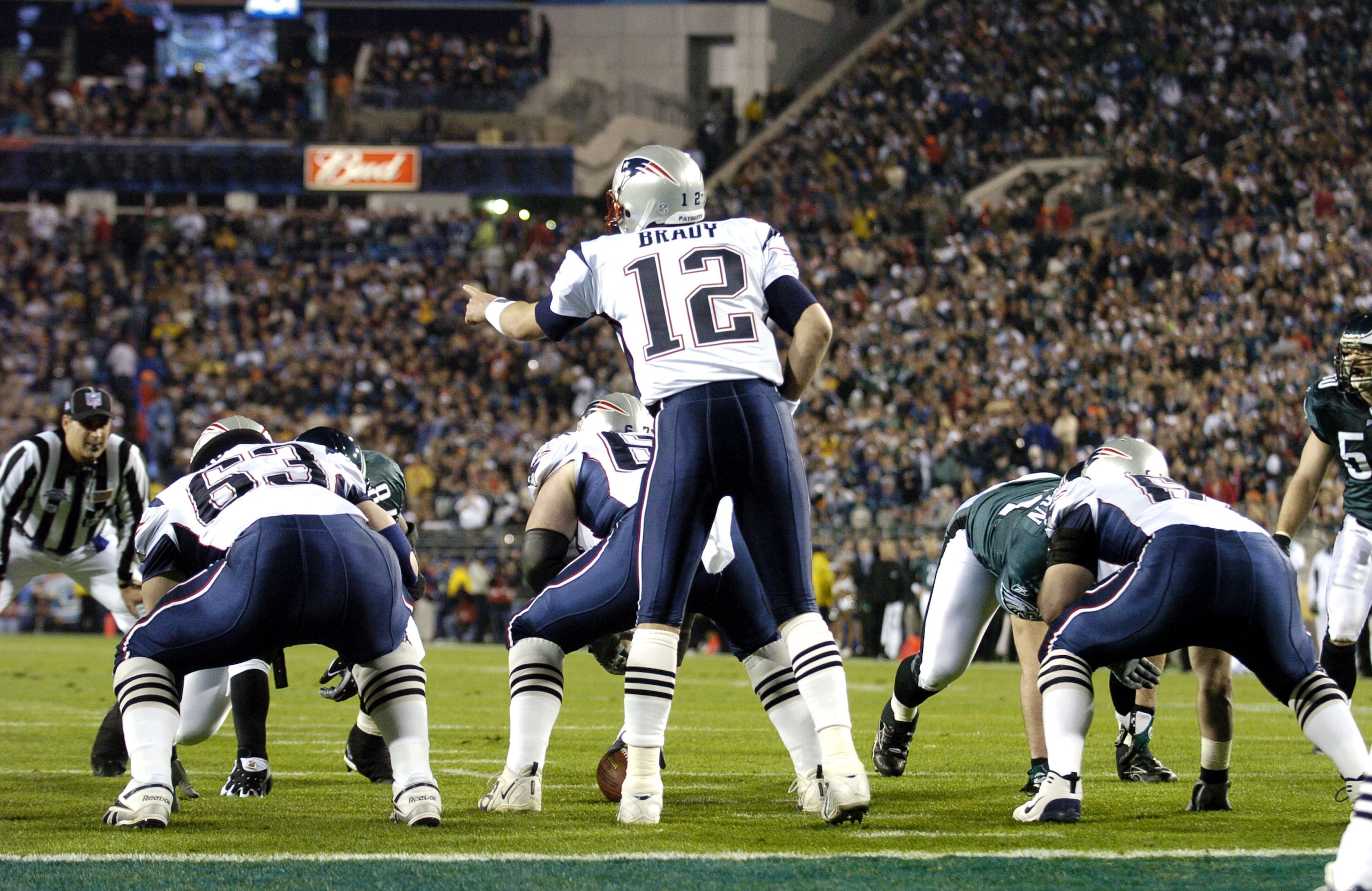 New England Patriots QB Tom Brady #12 calling signals during Super Bowl XXXIX between the Eagles and the New England Patriots at Alltel Stadium in Jacksonville, Florida on February 6, 2005.  (Photo by Al Messerschmidt/Getty Images)