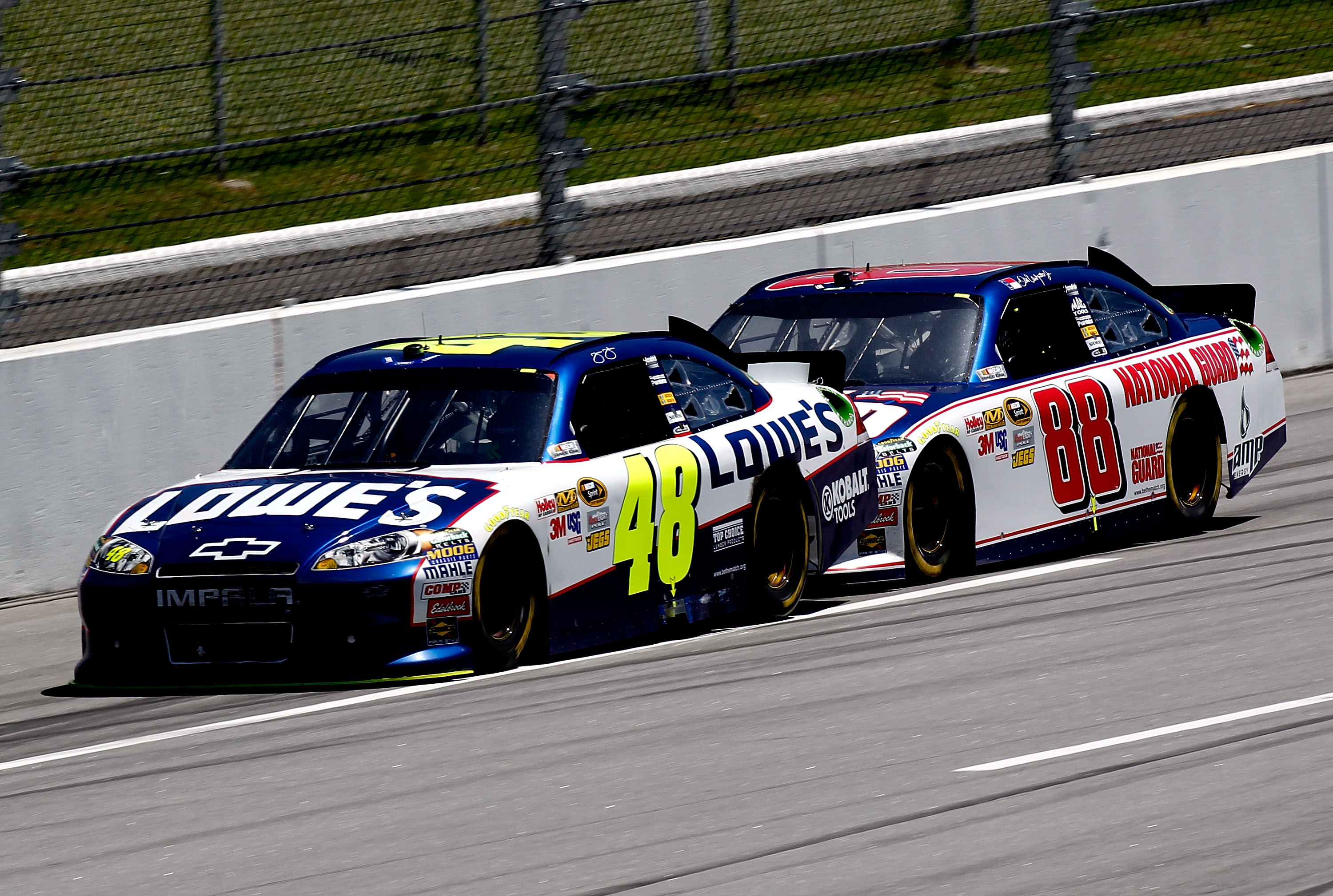 TALLADEGA, AL - APRIL 17: Jimmie Johnson, driver of the #48 Lowe's Chevrolet, leads Dale Earnhardt Jr., driver of the #88 National Guard/Amp Energy Chevrolet, during the NASCAR Sprint Cup Series Aaron's 499 at Talladega Superspeedway on April 17, 2011 in