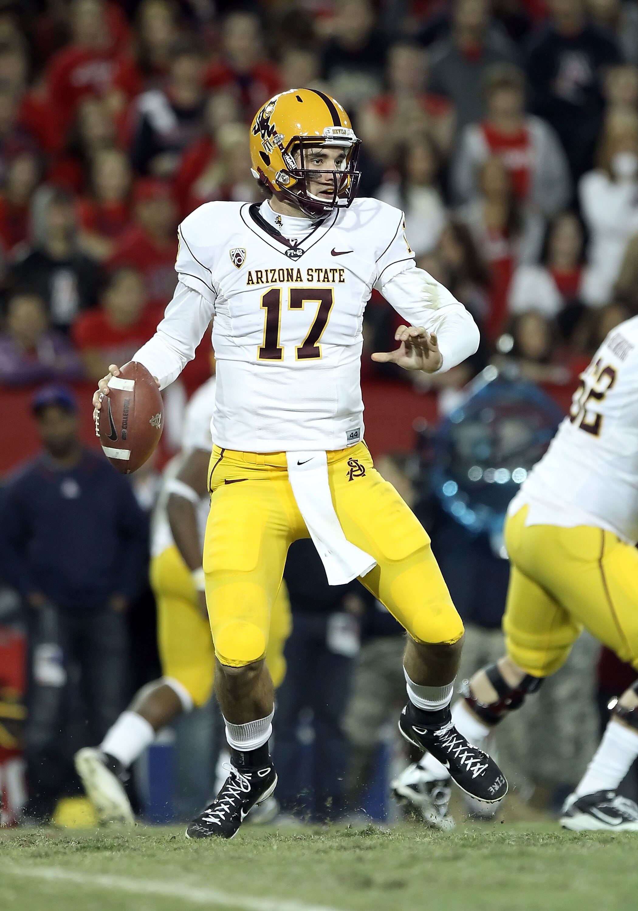 TUCSON, AZ - DECEMBER 02:  Quarterback Brock Osweiler #17 of the Arizona State Sun Devils scrambles with the football during the college football game at Arizona Stadium on December 2, 2010 in Tucson, Arizona. The Sun Devils defeated the Wildcats 30-29 in