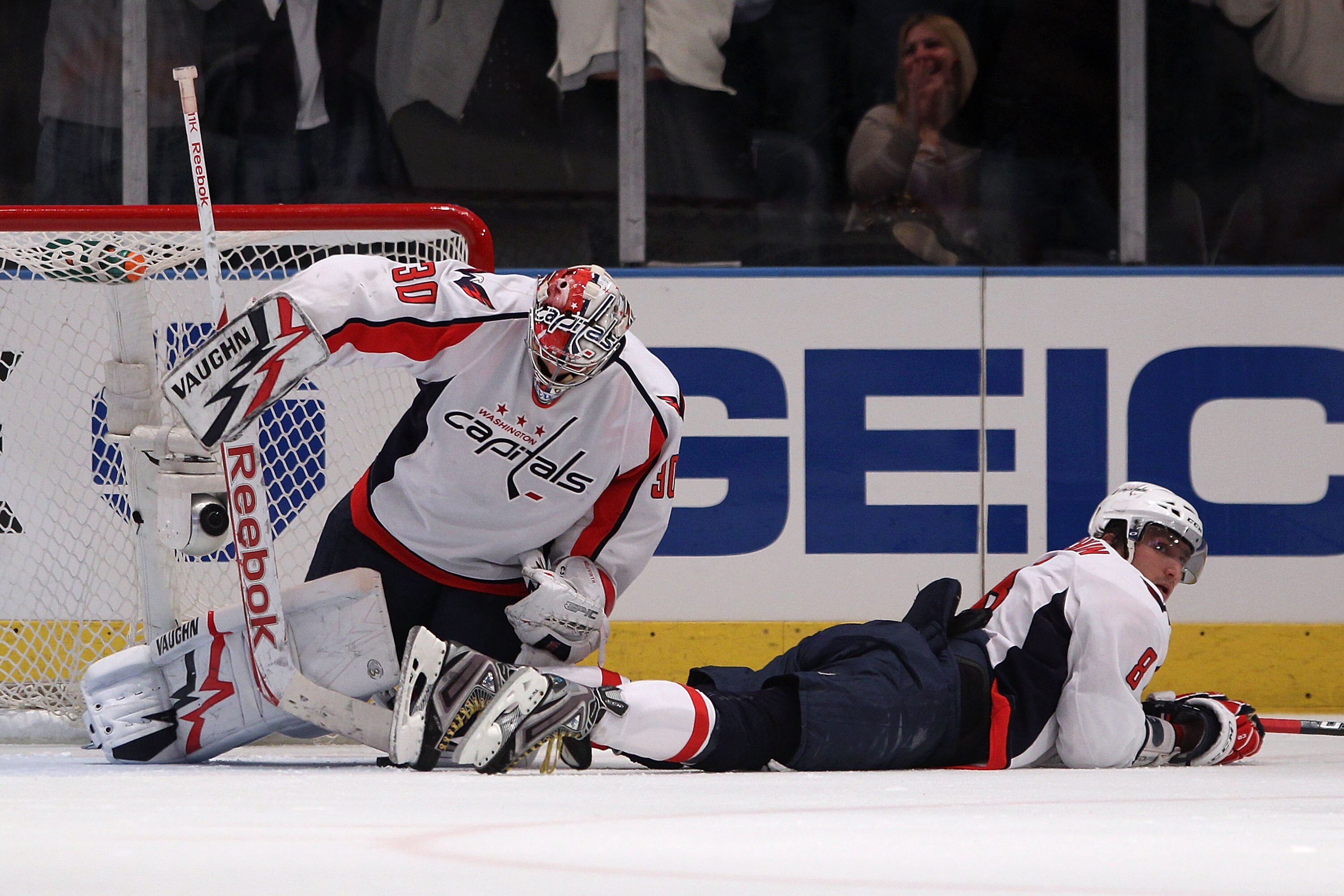 NEW YORK, NY - APRIL 17:  (L-R) Goalie Michal Neuvirth #30 and Alex Ovechkin #8 of the Washington Capitals react after Brandon Dubinsky #17 of the New York Rangers scored the game-winning goal in Game Three of the Eastern Conference Quarterfinals during t