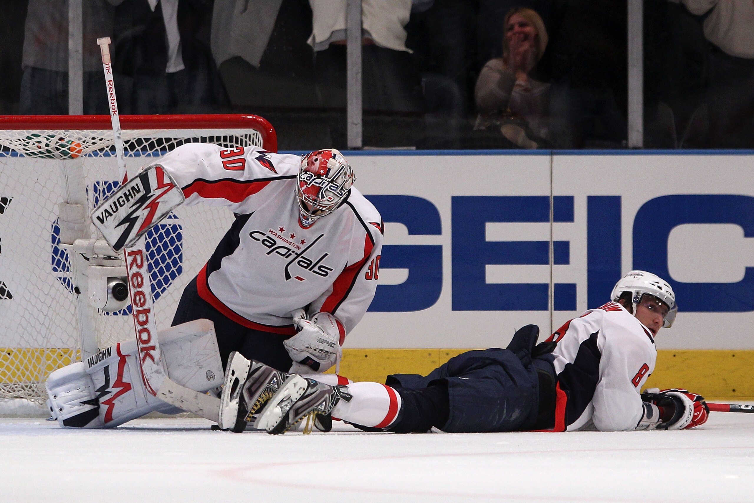 NEW YORK, NY - APRIL 17:  (L-R) Goalie Michal Neuvirth #30 and Alex Ovechkin #8 of the Washington Capitals react after Brandon Dubinsky #17 of the New York Rangers scored the game-winning goal in Game Three of the Eastern Conference Quarterfinals during t